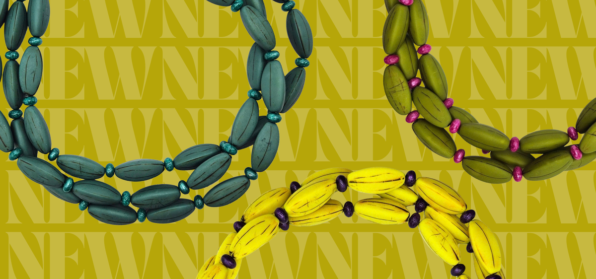 promotional image with three necklaces in the foreground, 1 teal, 1 olive, 1 yellow. Background says "new" in repeat
