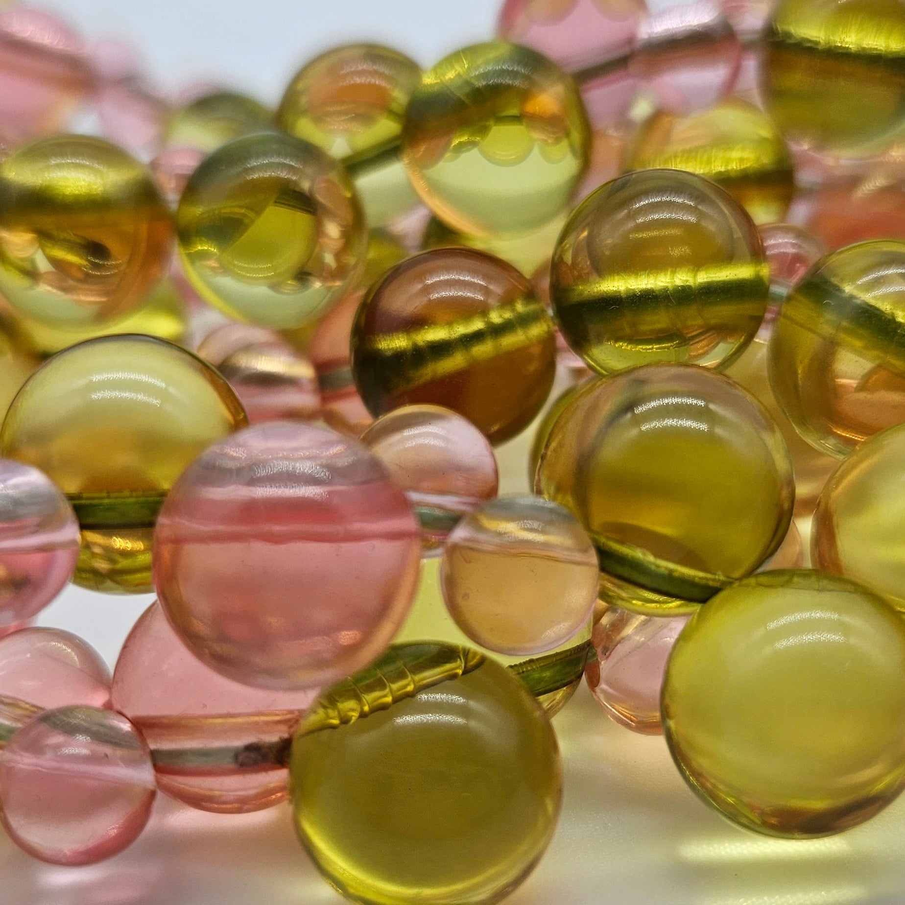 Close-up of multicolored lucite beads on a white background