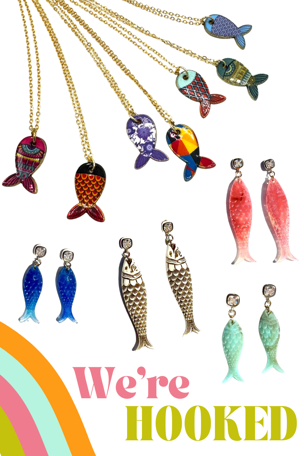A collage of fish-shaped jewelry pieces on a white background, including several necklaces with gold-tone chains and colorful fish pendants, several pairs of dangling earrings in blue, silver, red, pink, green, and teal, and large text at the bottom reading 'We're HOOKED' with a rainbow graphic.