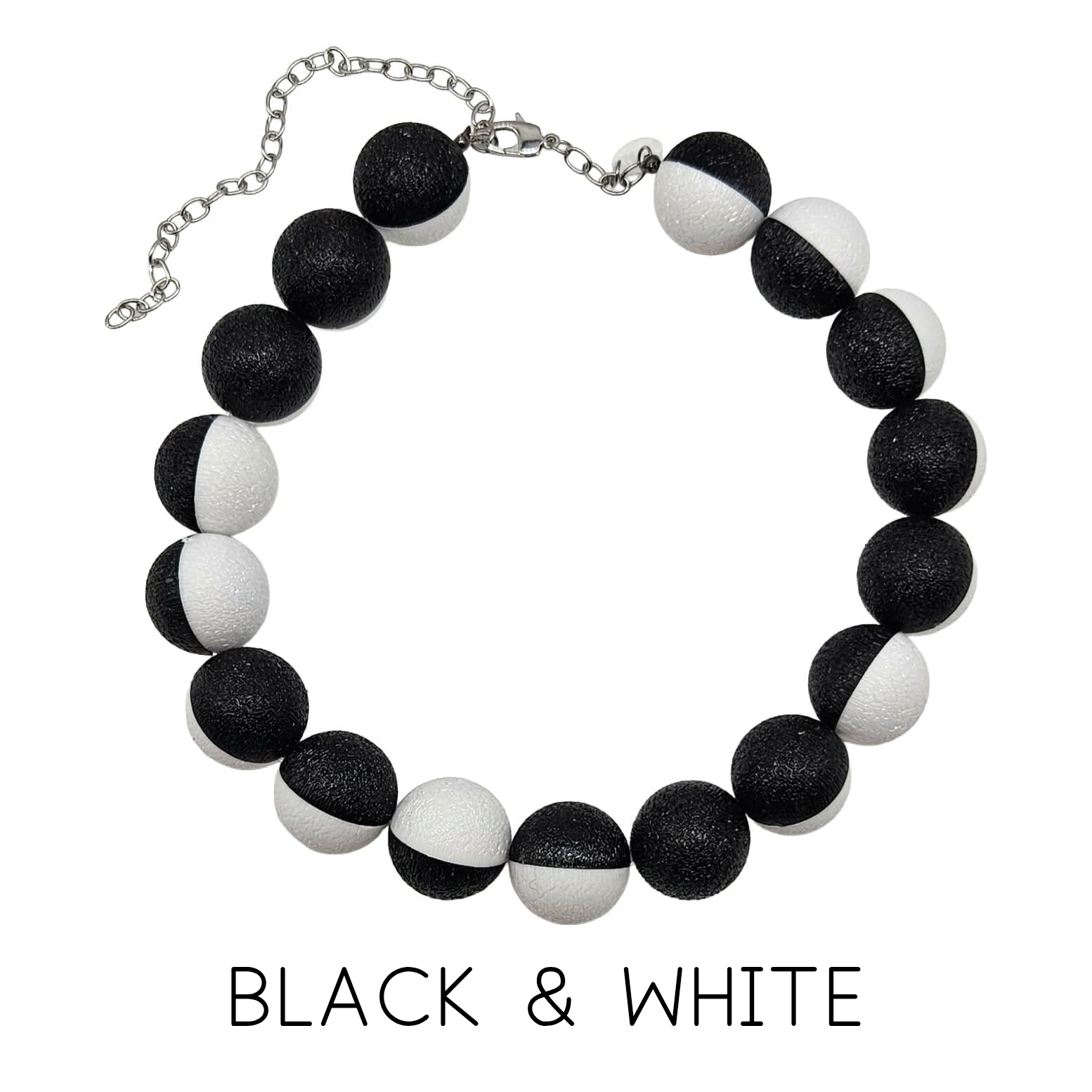 Black and white beaded necklace on a white background