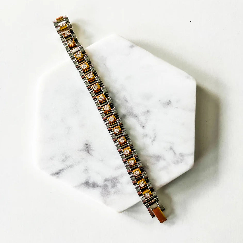 Bracelet with brown stones on a marble surface