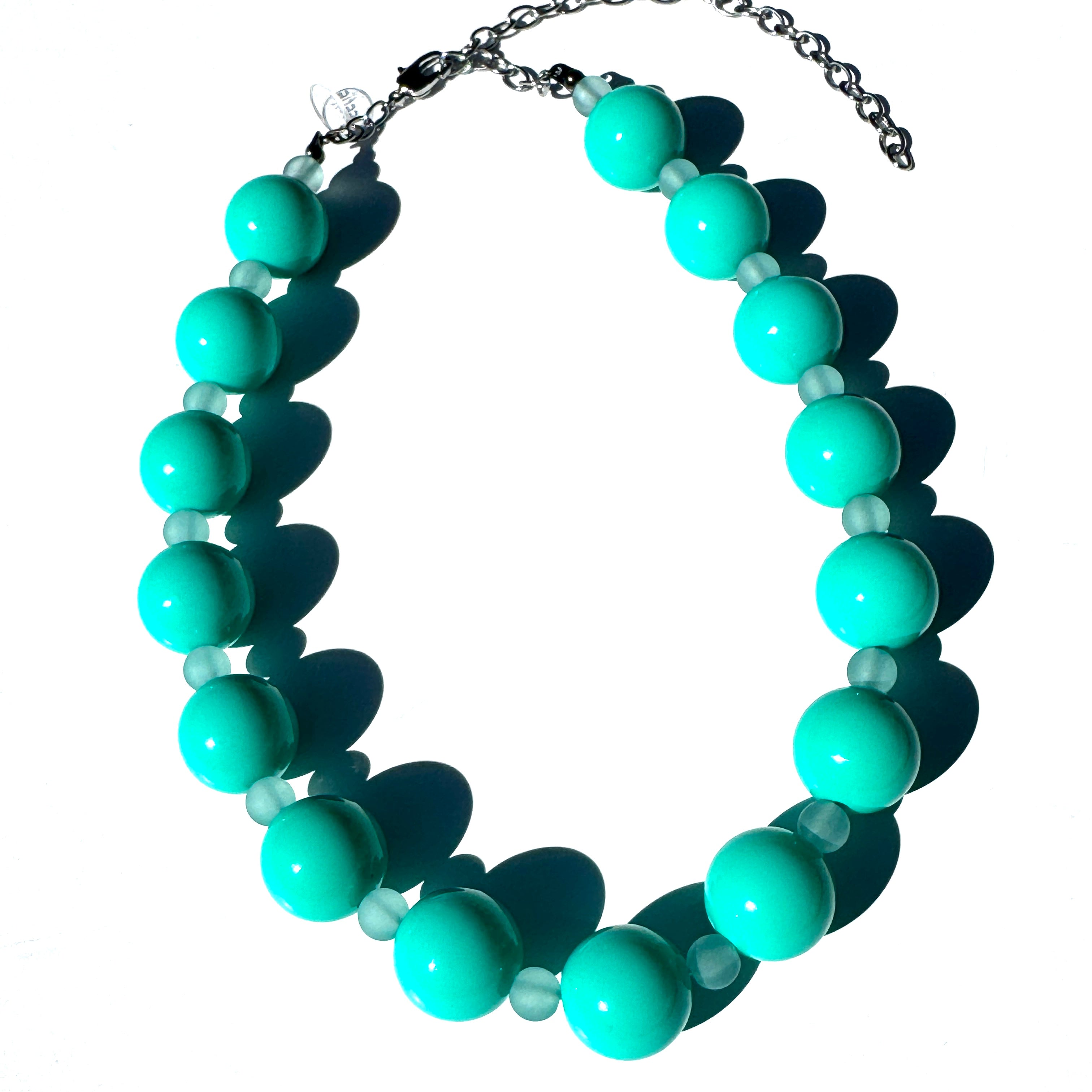 Turquoise beaded necklace on a white background