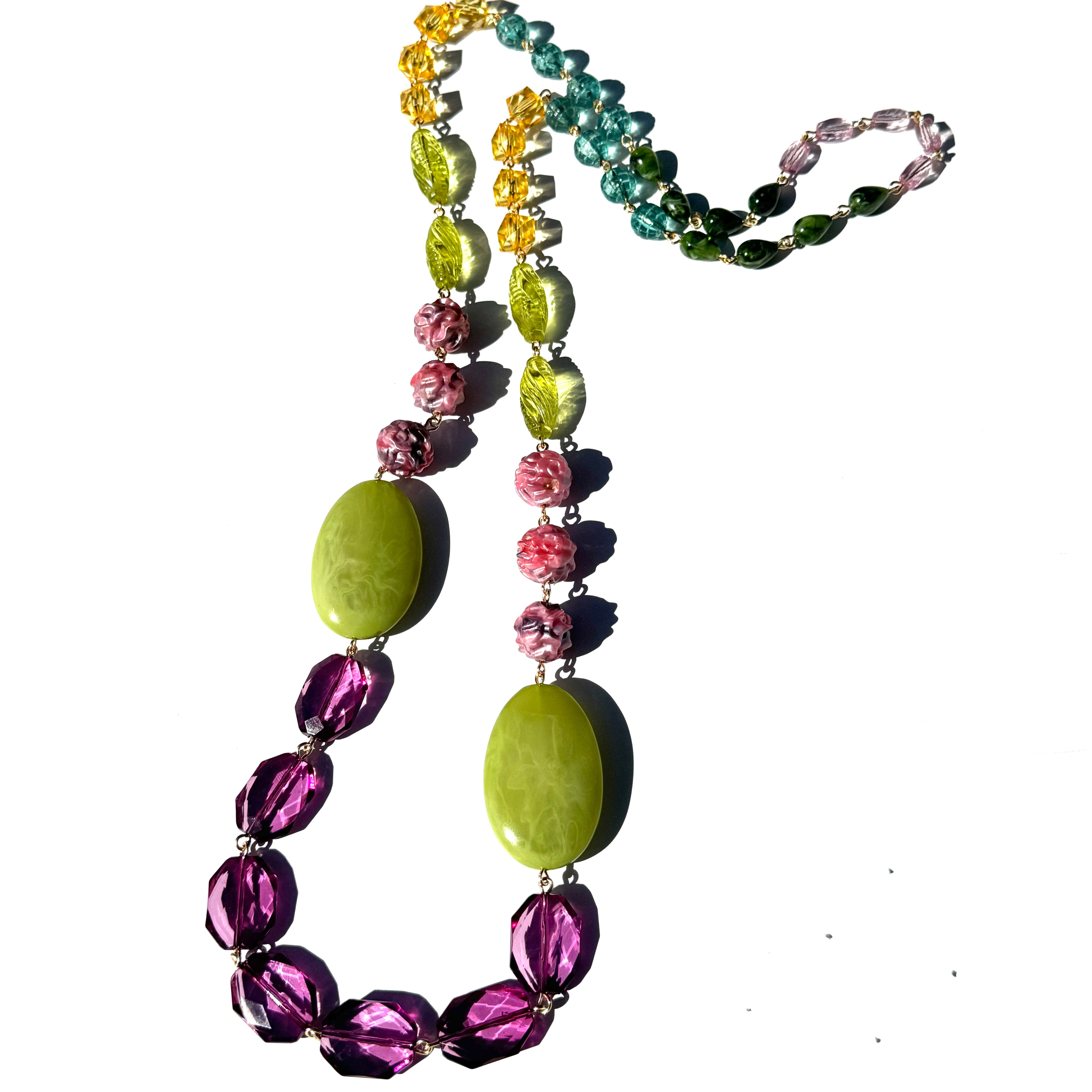 Necklace with multicolored beads on a white background