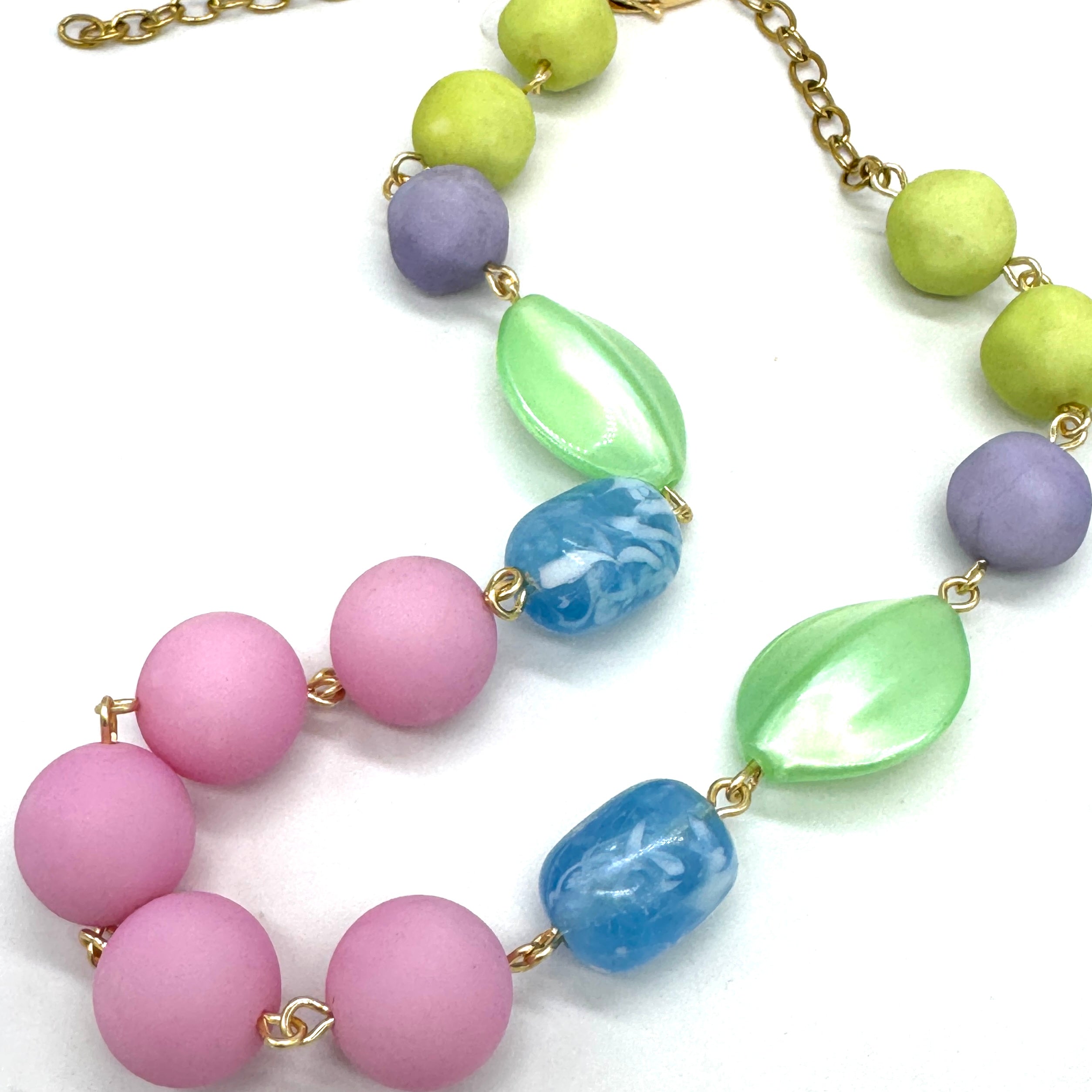 Necklace with pastel-colored beads on a white background