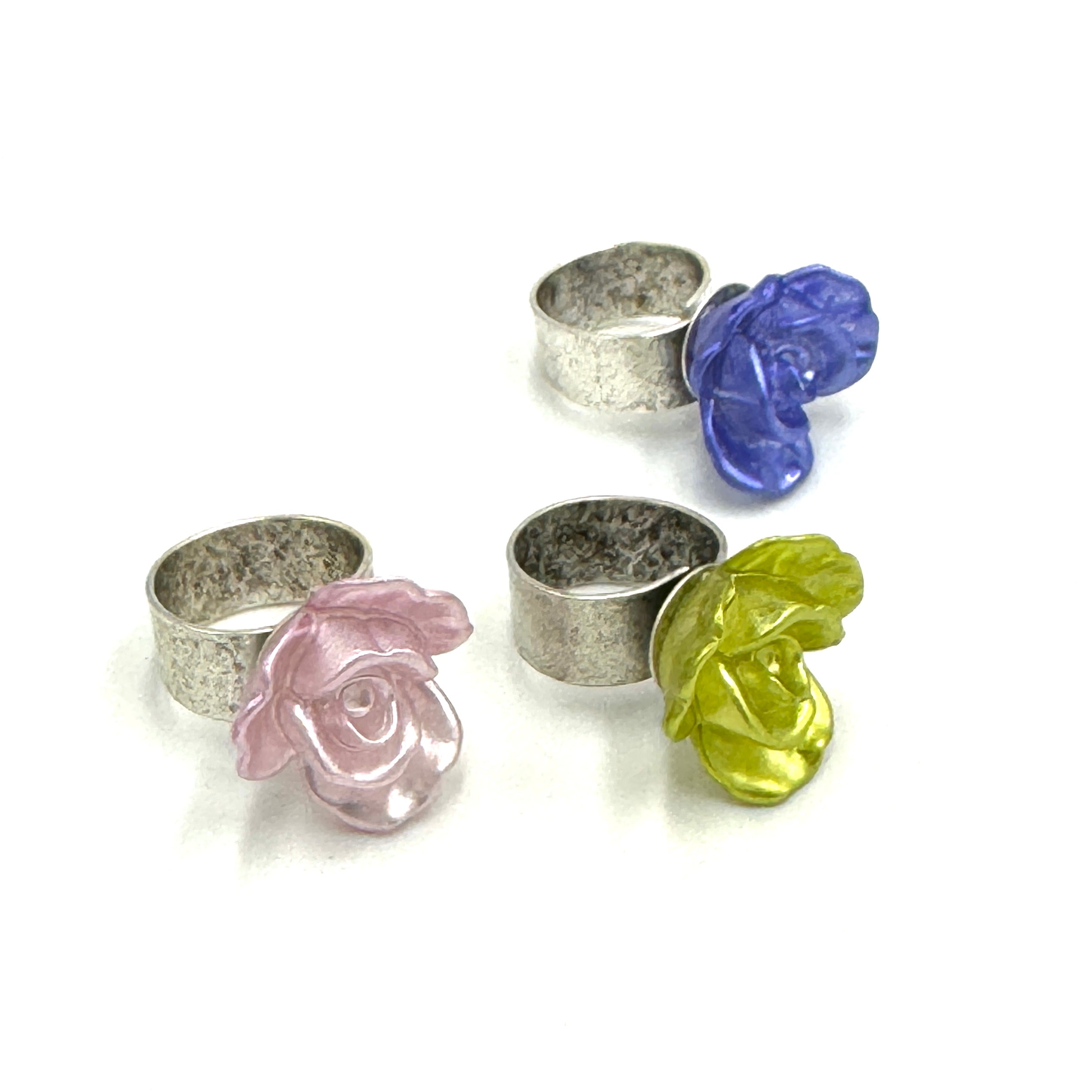 3 silver rings with flowers