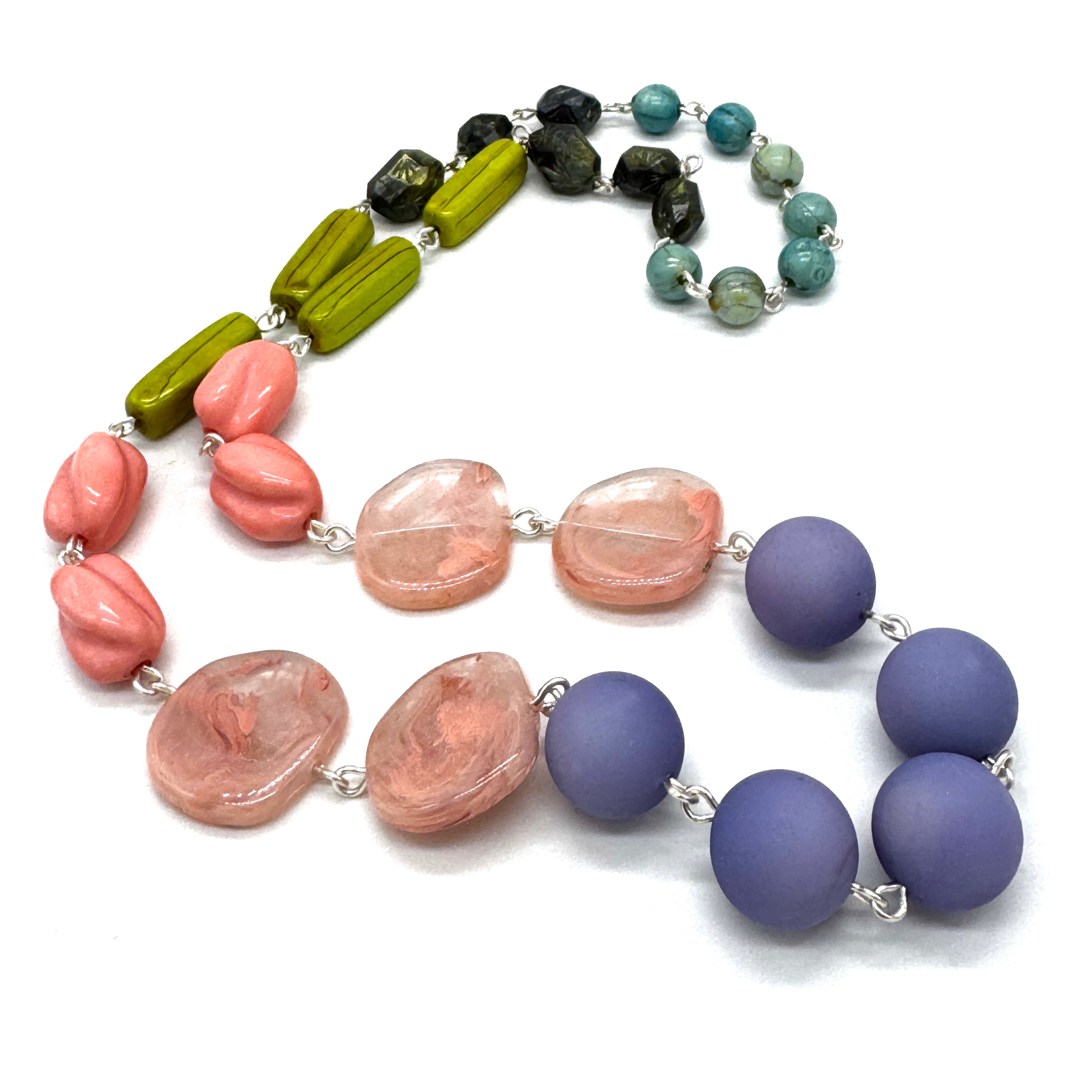 Necklace with multicolored beads on a white background