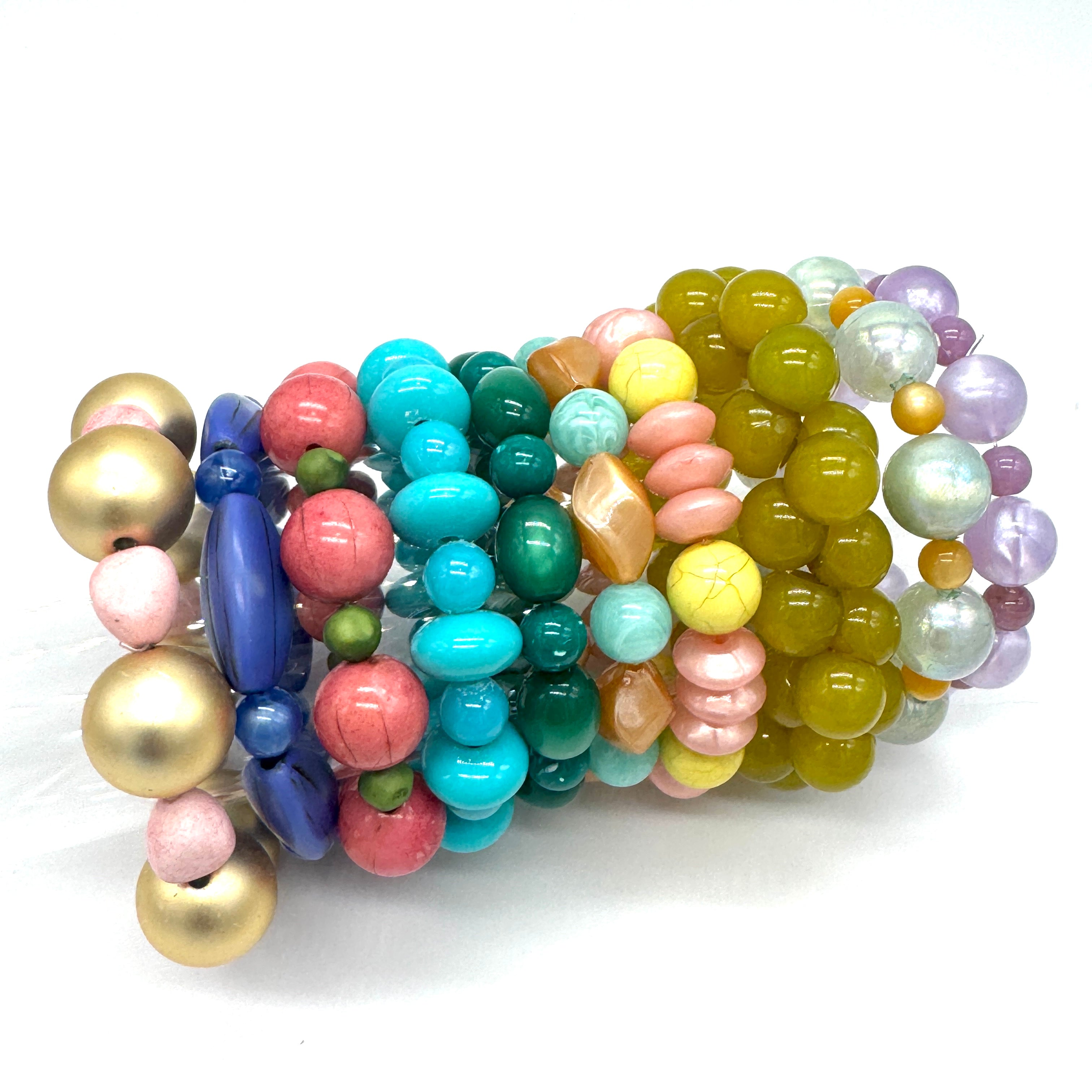 Colorful beaded bracelets on a white background