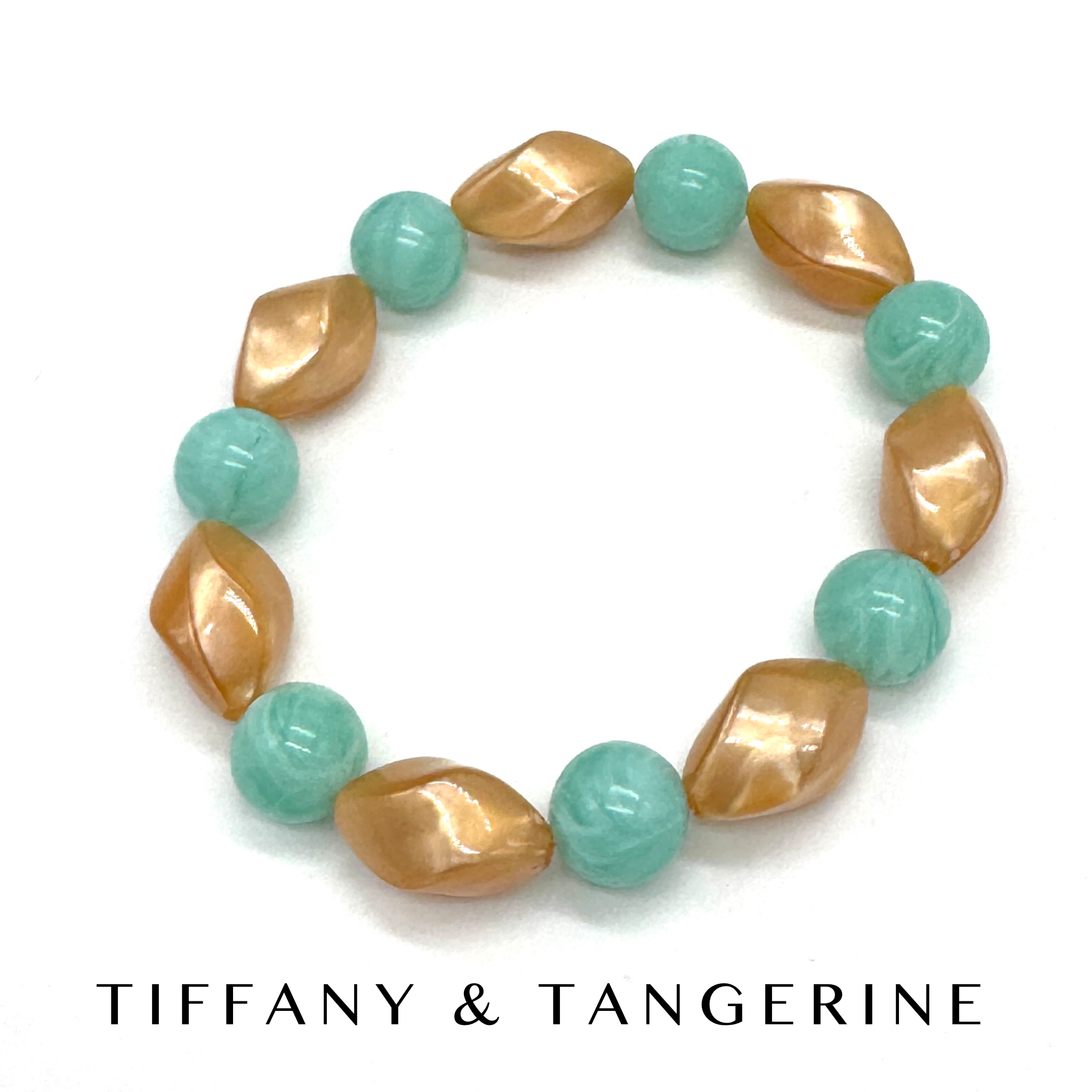 Bracelet with gold and turquoise beads on a white background, featuring &