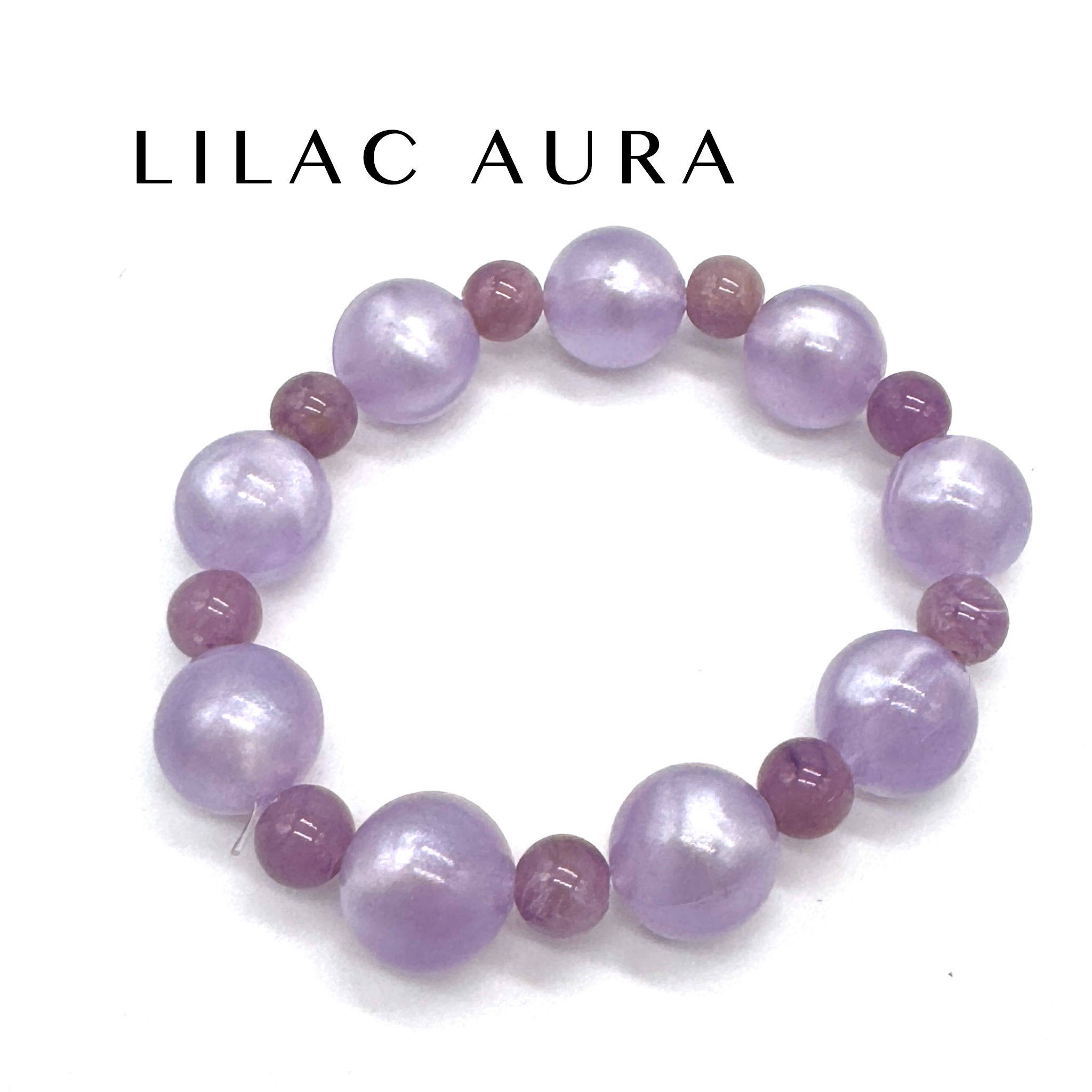 Lilac and pink beaded bracelet on a white background with &