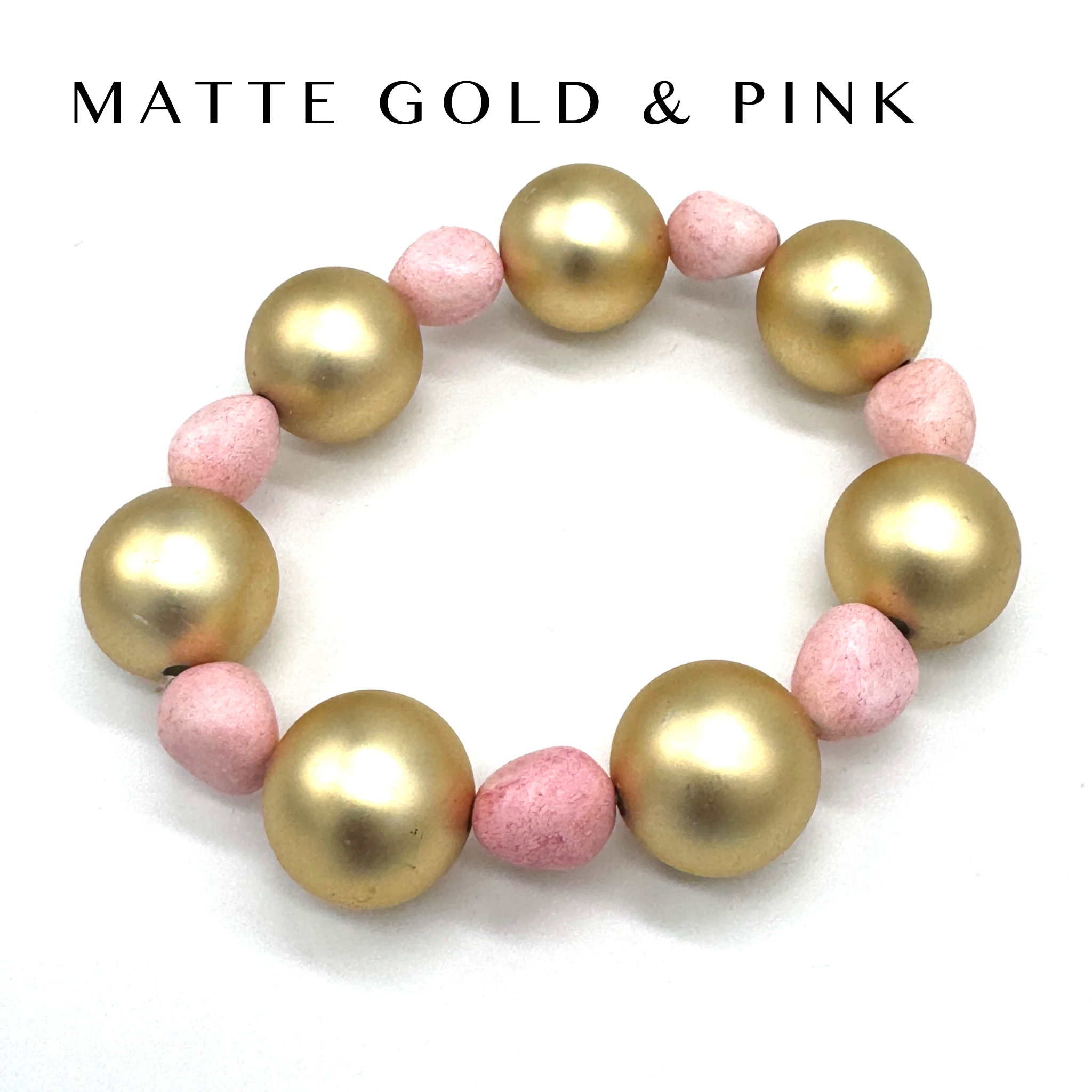 Bracelet with gold and pink beads on a white background