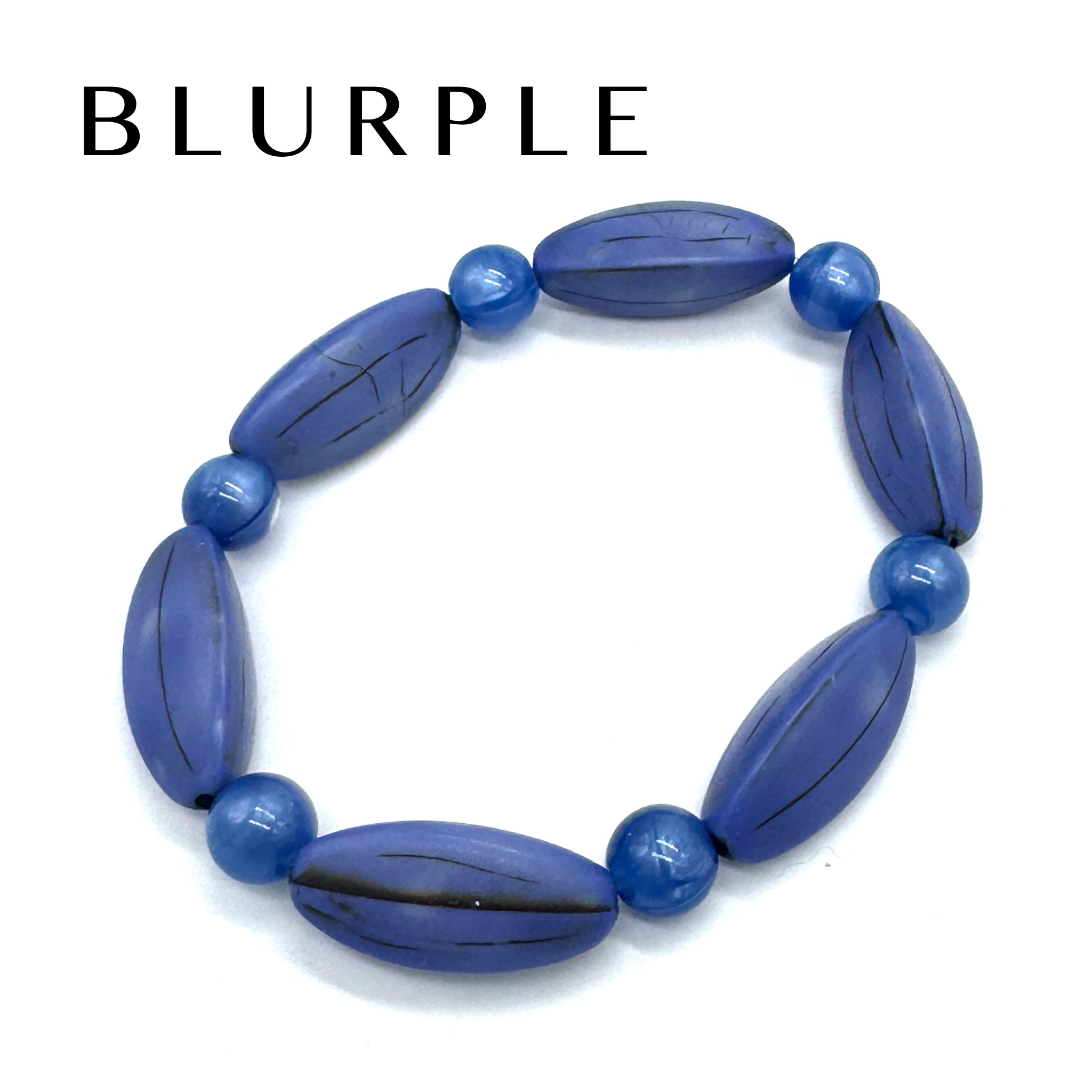 Blue beaded bracelet on a white background with &