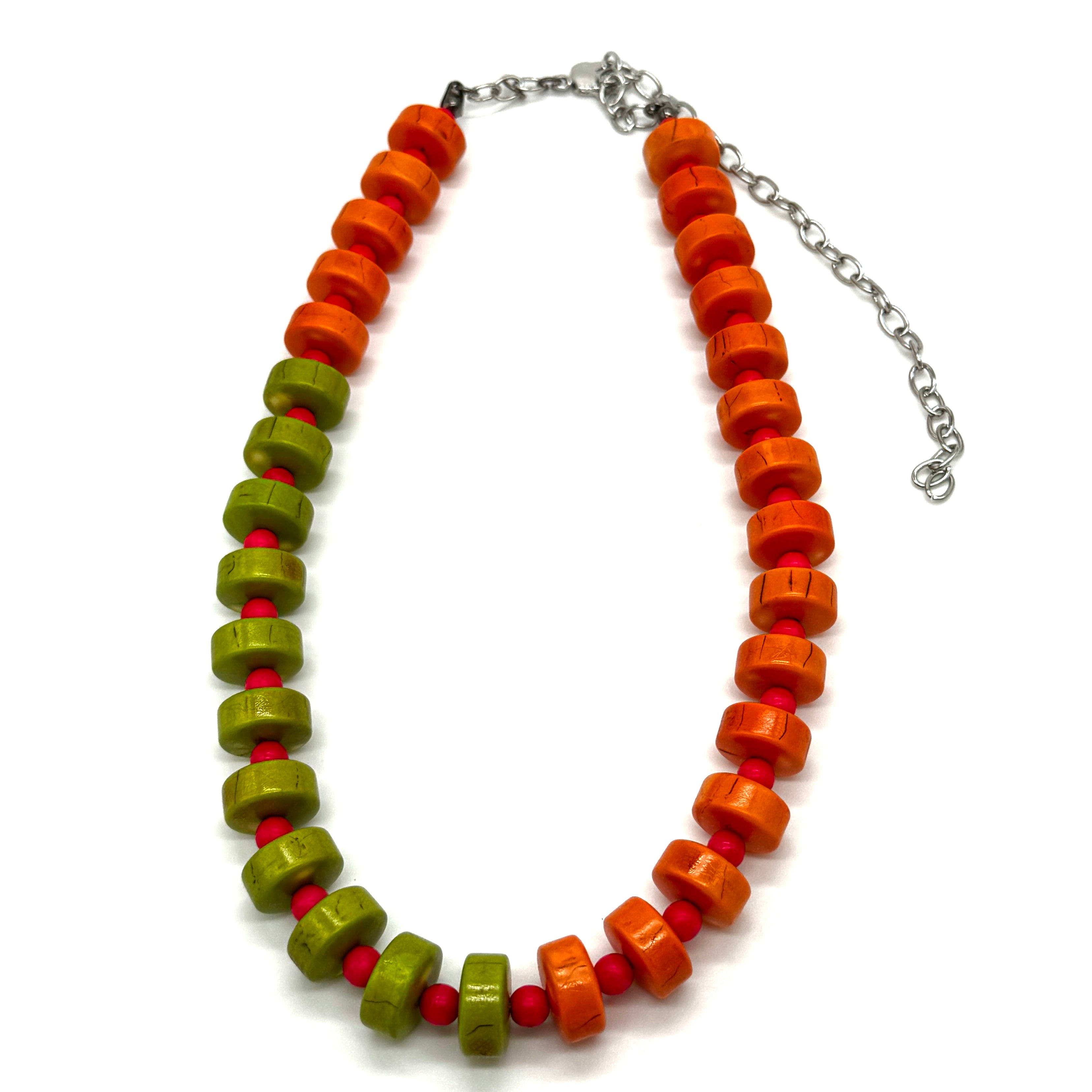 Necklace with orange, green, and red beads on a white background