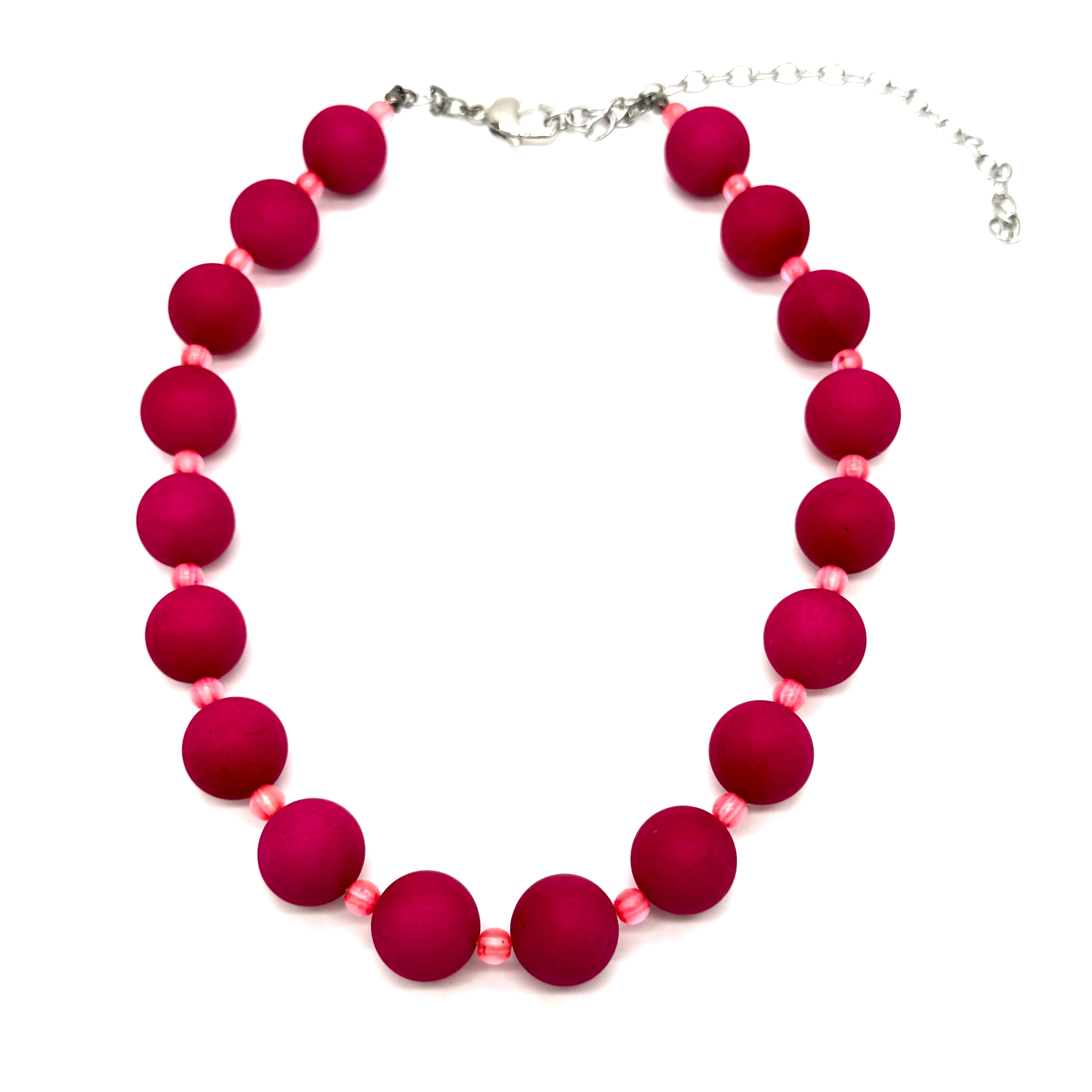 Necklace with pink beads on a white background
