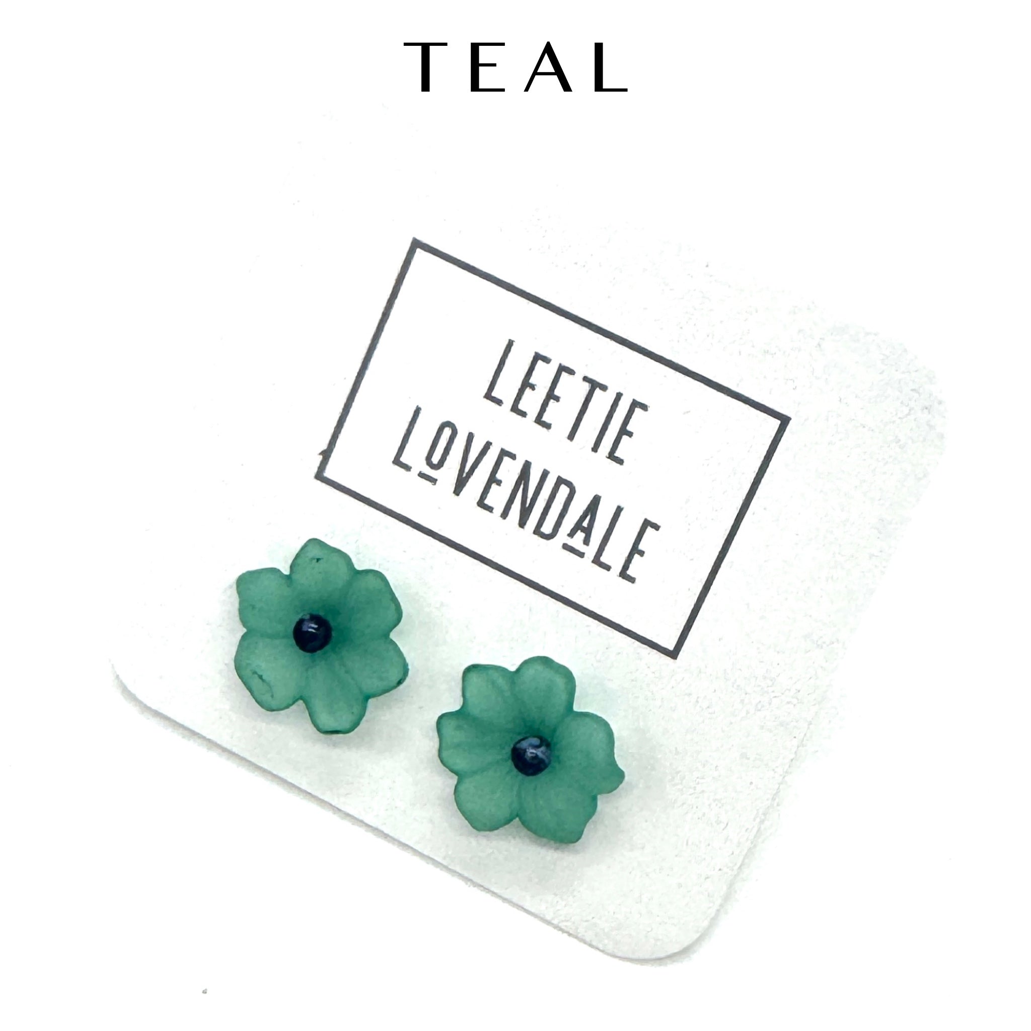 Teal flower stud earrings on a white background