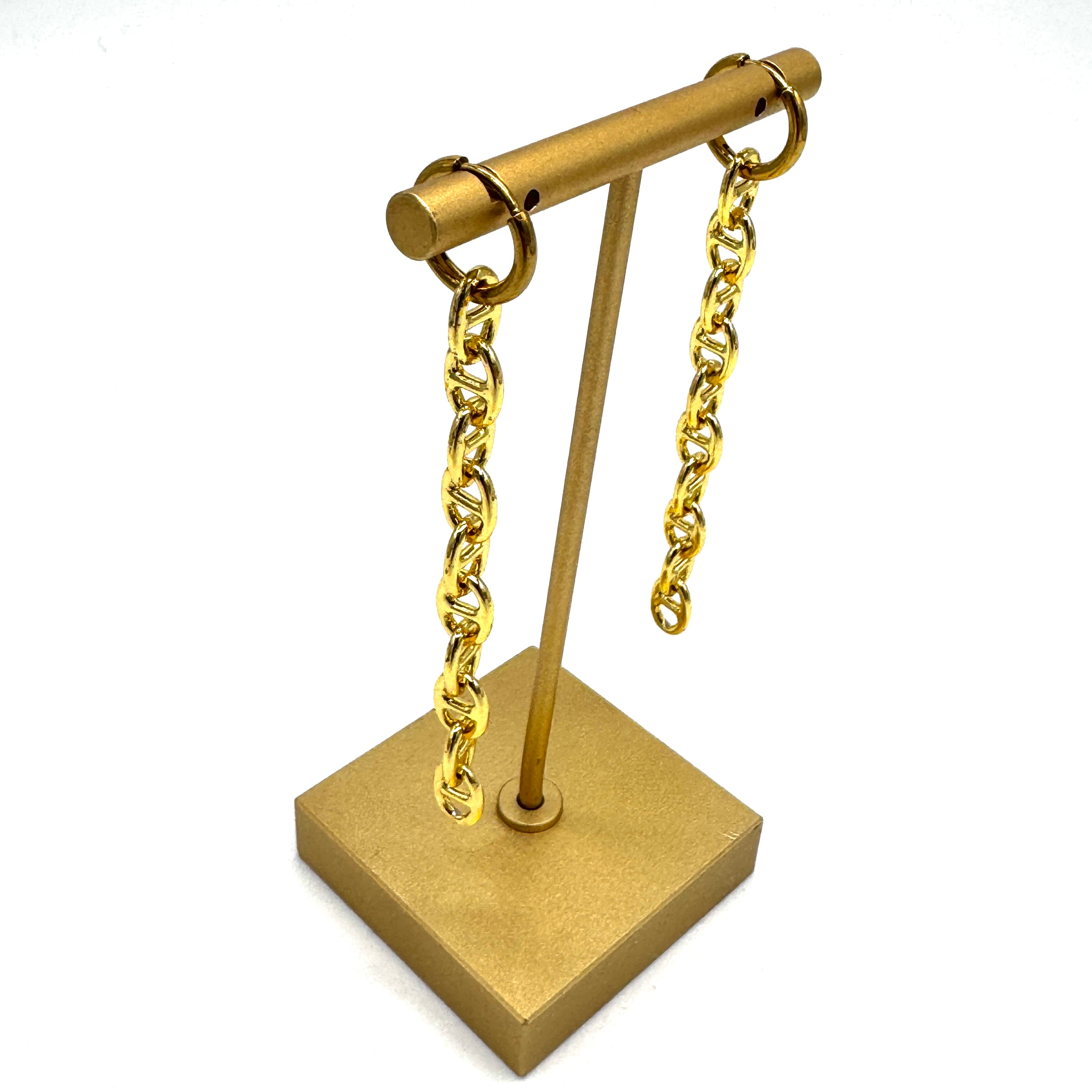 Gold-tone chain earrings displayed on a matching gold jewelry stand against a plain white background.