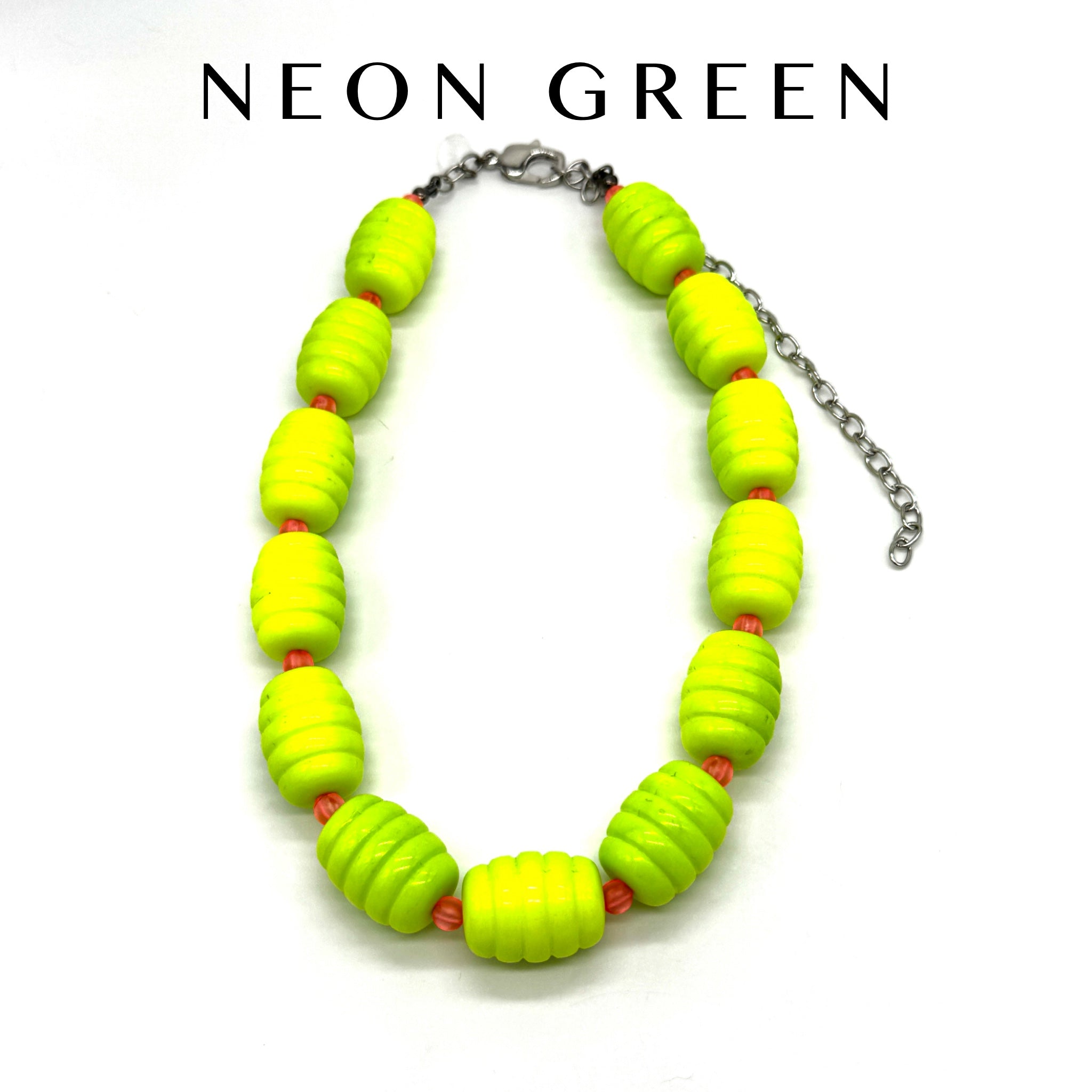 Neon green beaded necklace on a white background with &