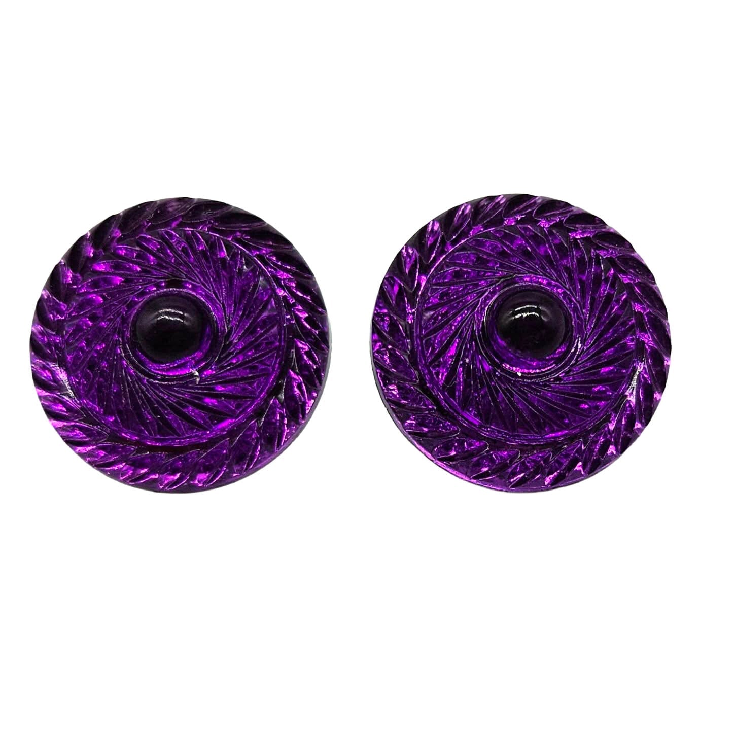 Two purple swirl-patterned earrings on a white background