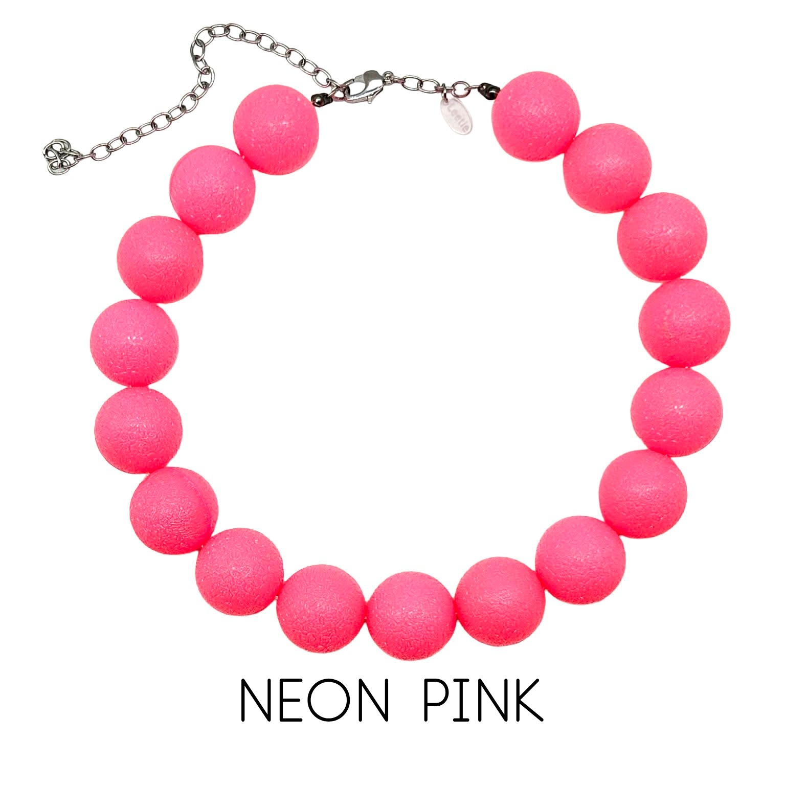 Neon pink beaded necklace on a white background with &