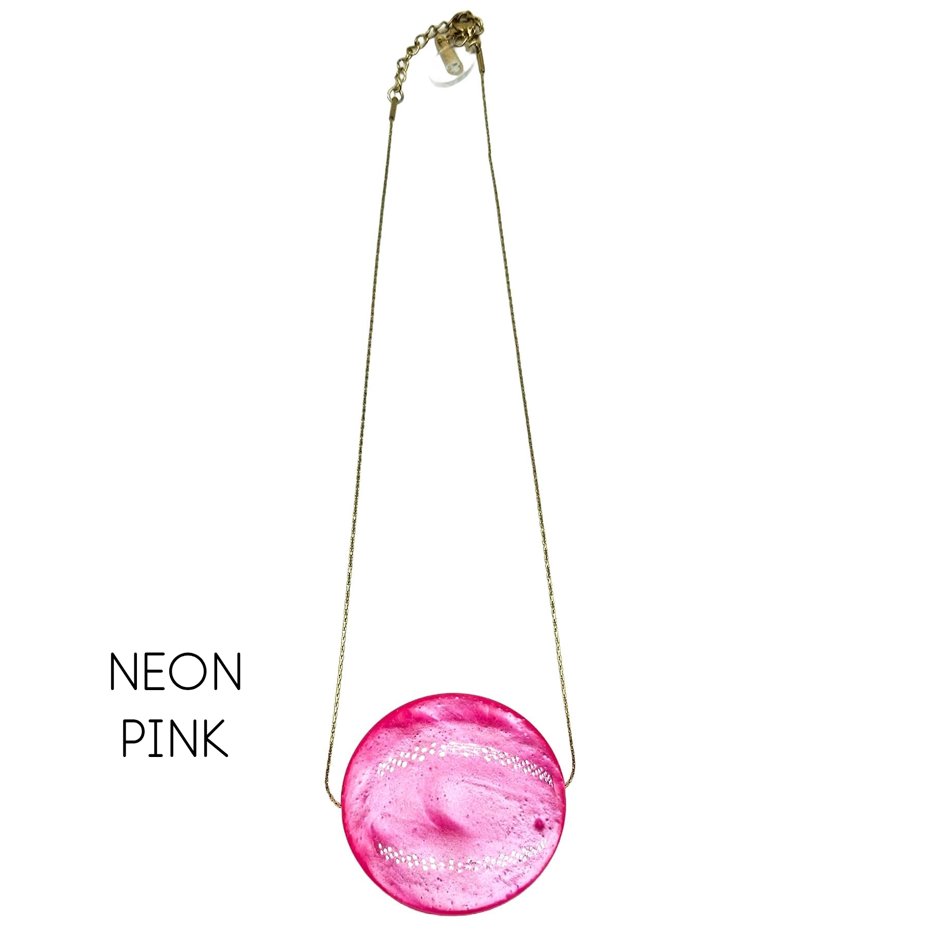 Neon pink round pendant necklace on a white background