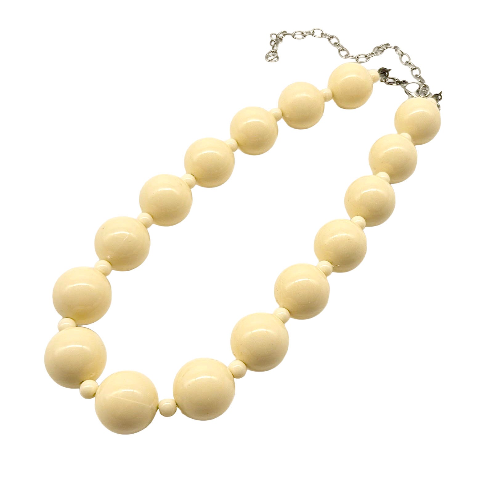 Cream-colored beaded necklace on a white background
