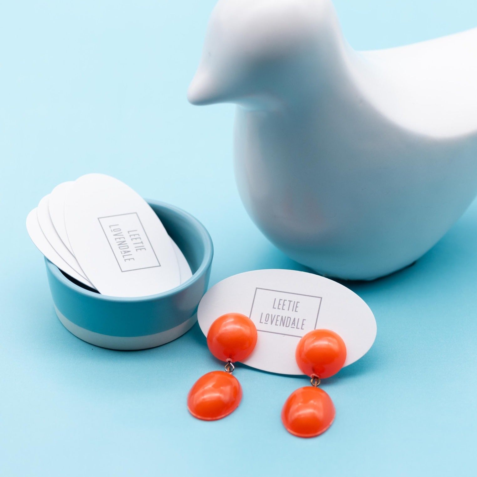 orange aura lucite earrings