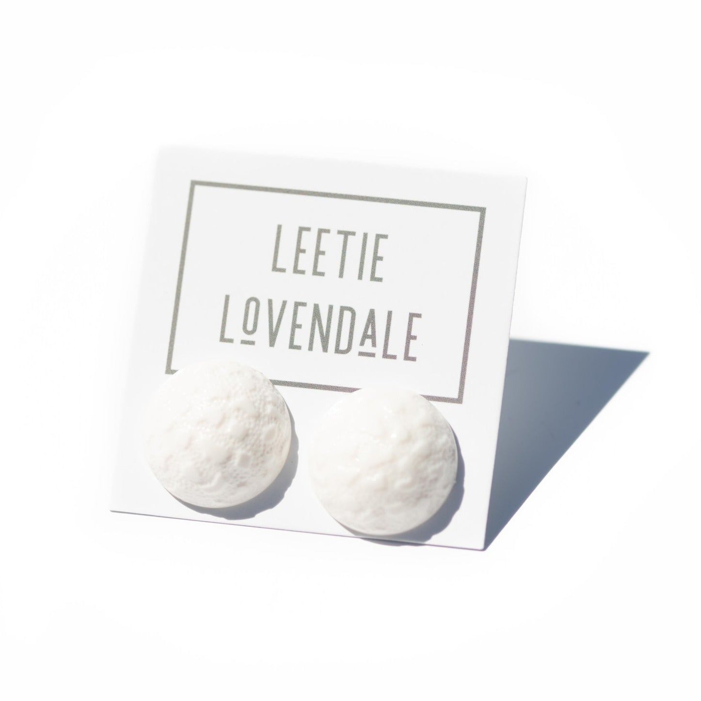 bright white earrings