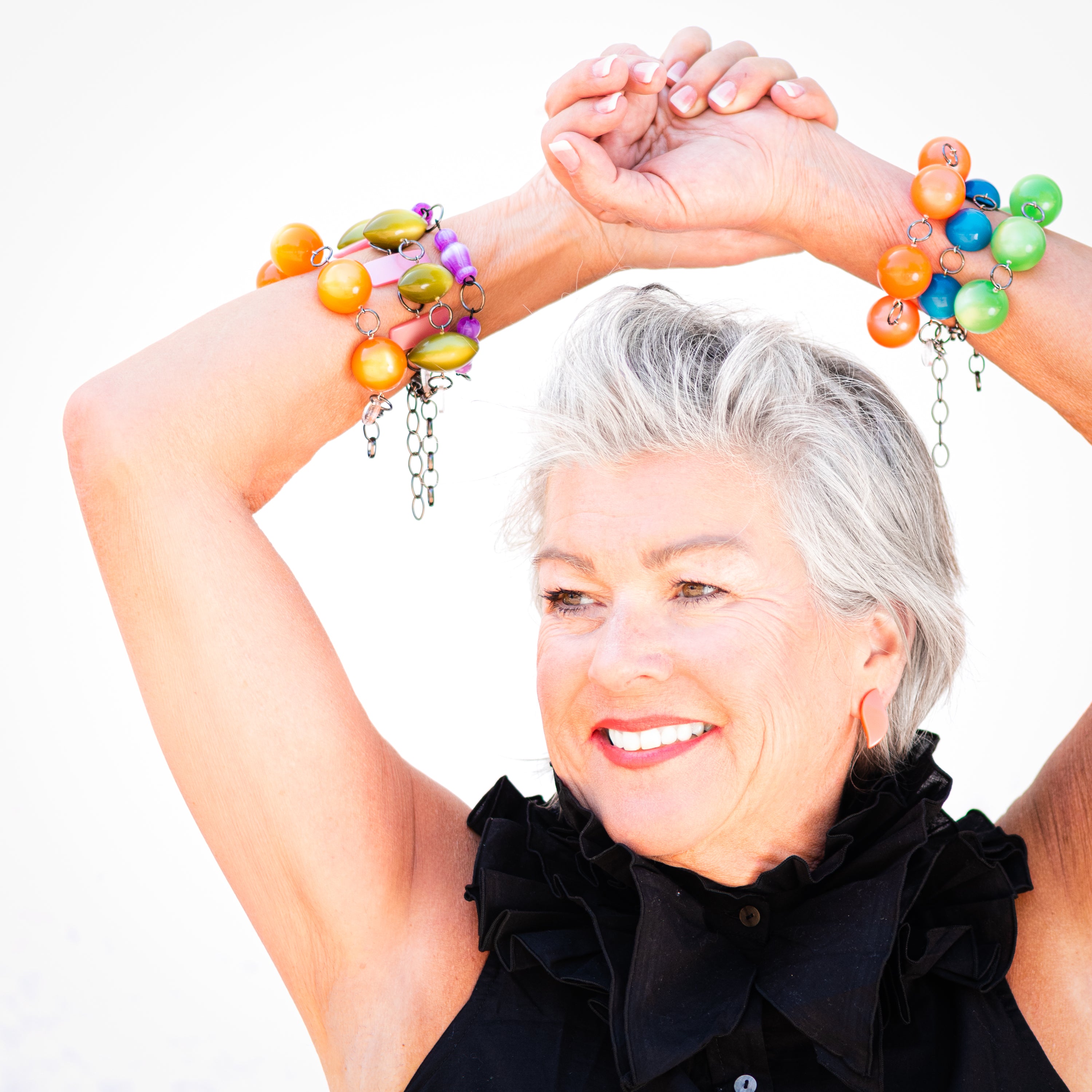 stacks of moonglow bracelets on model