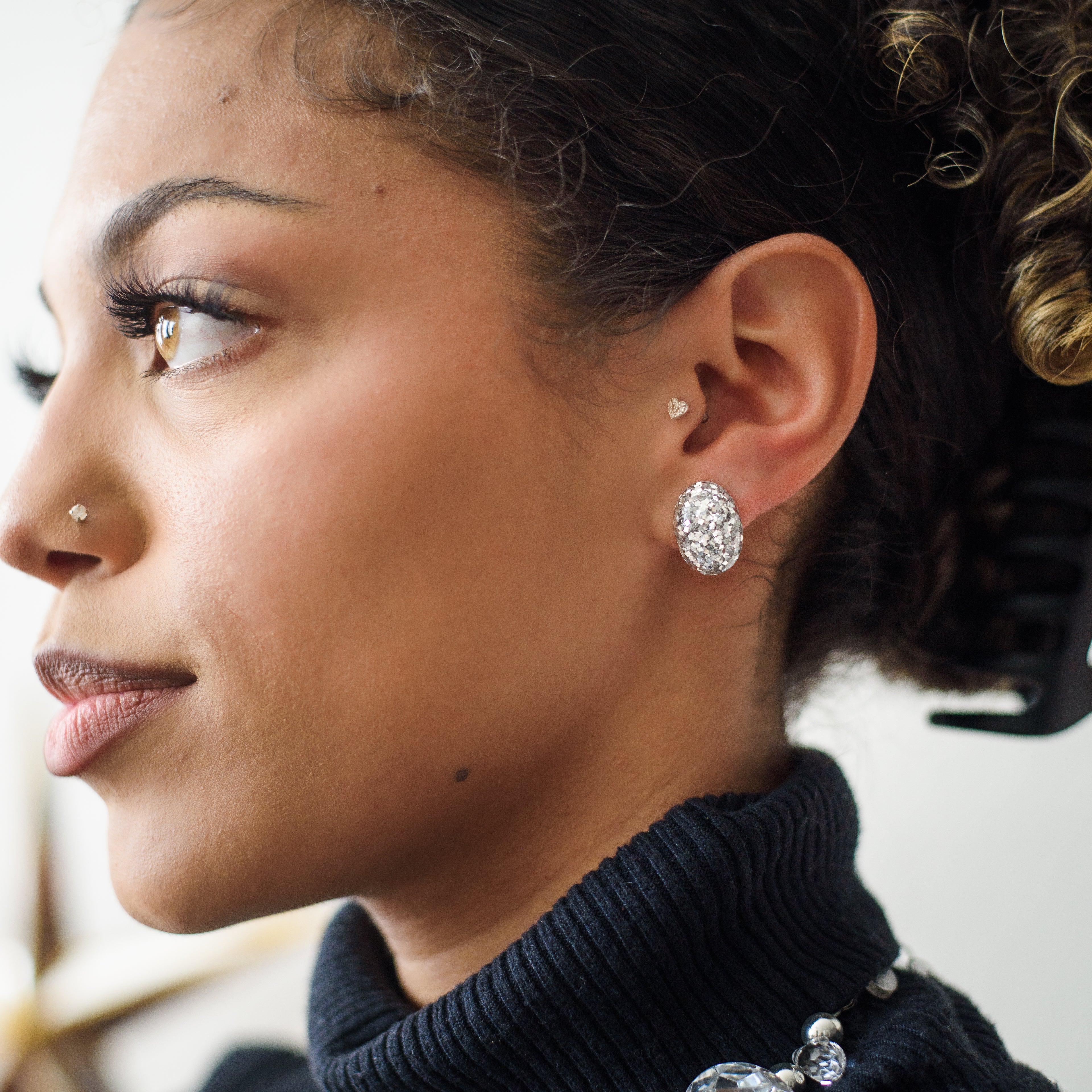 silver glitter earrings on ashlie