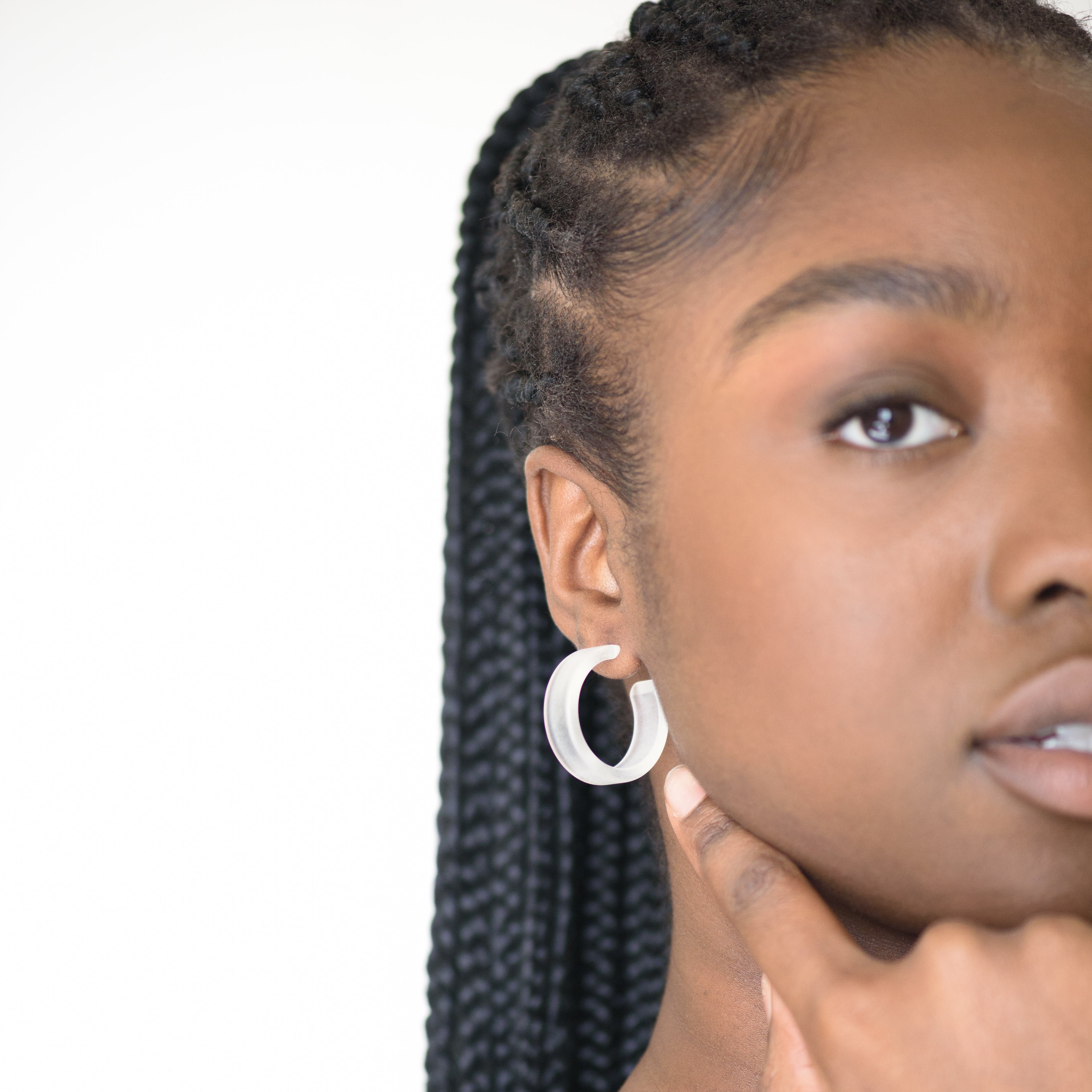 froste clear hoops on black model with braids