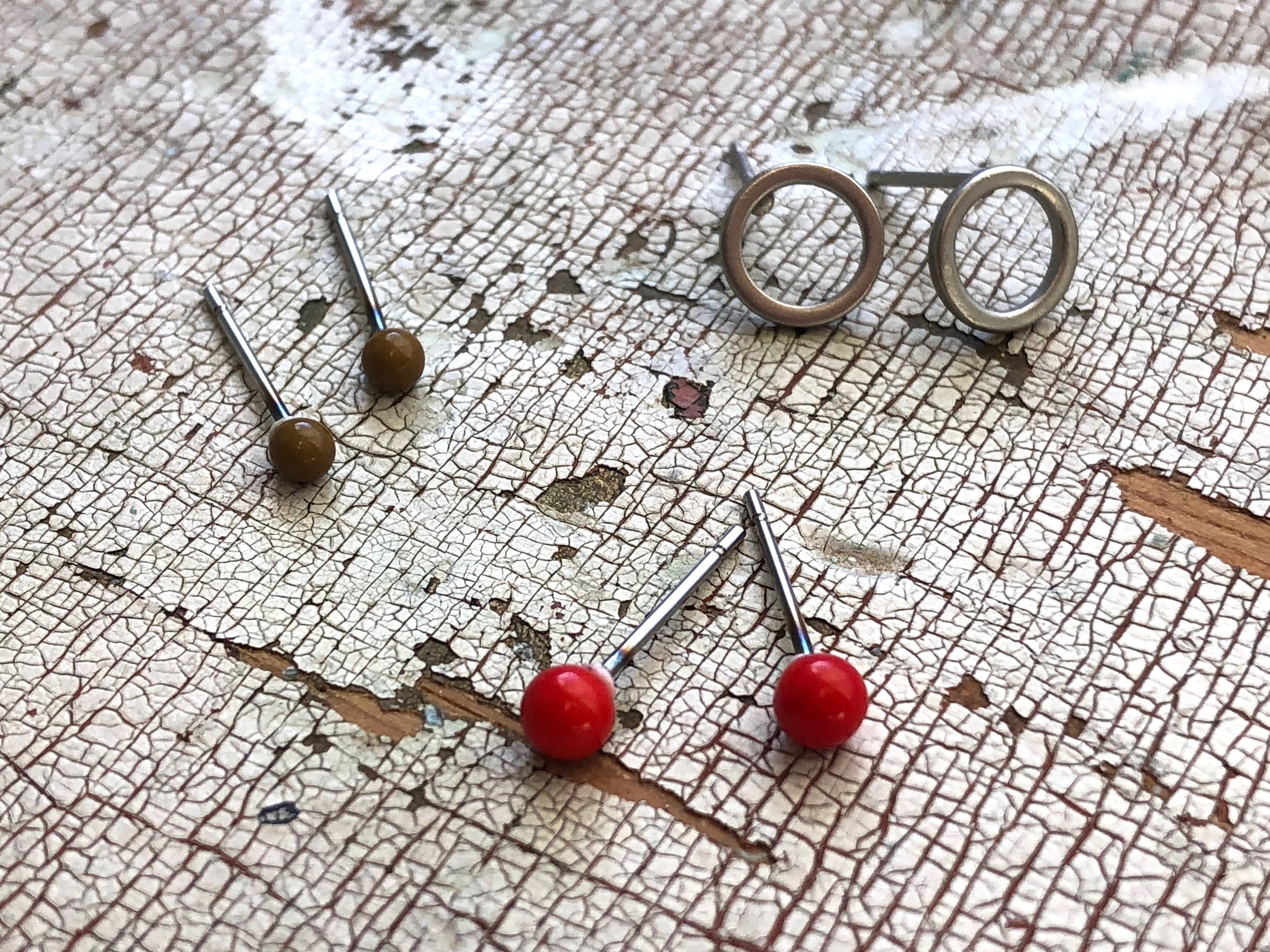 red minimalist studs
