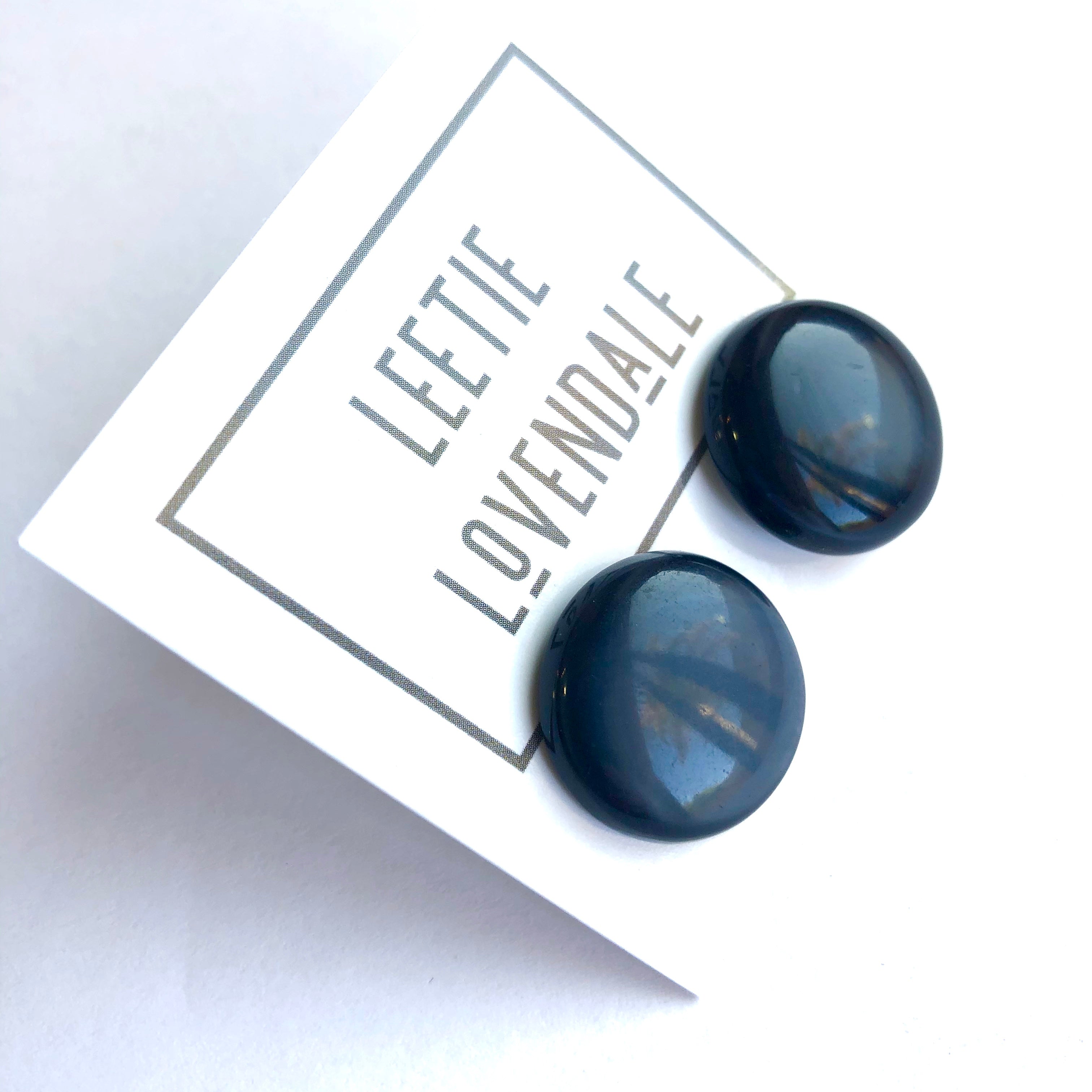 black moonglow disc studs