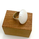 white dimpled cocktail ring on stand