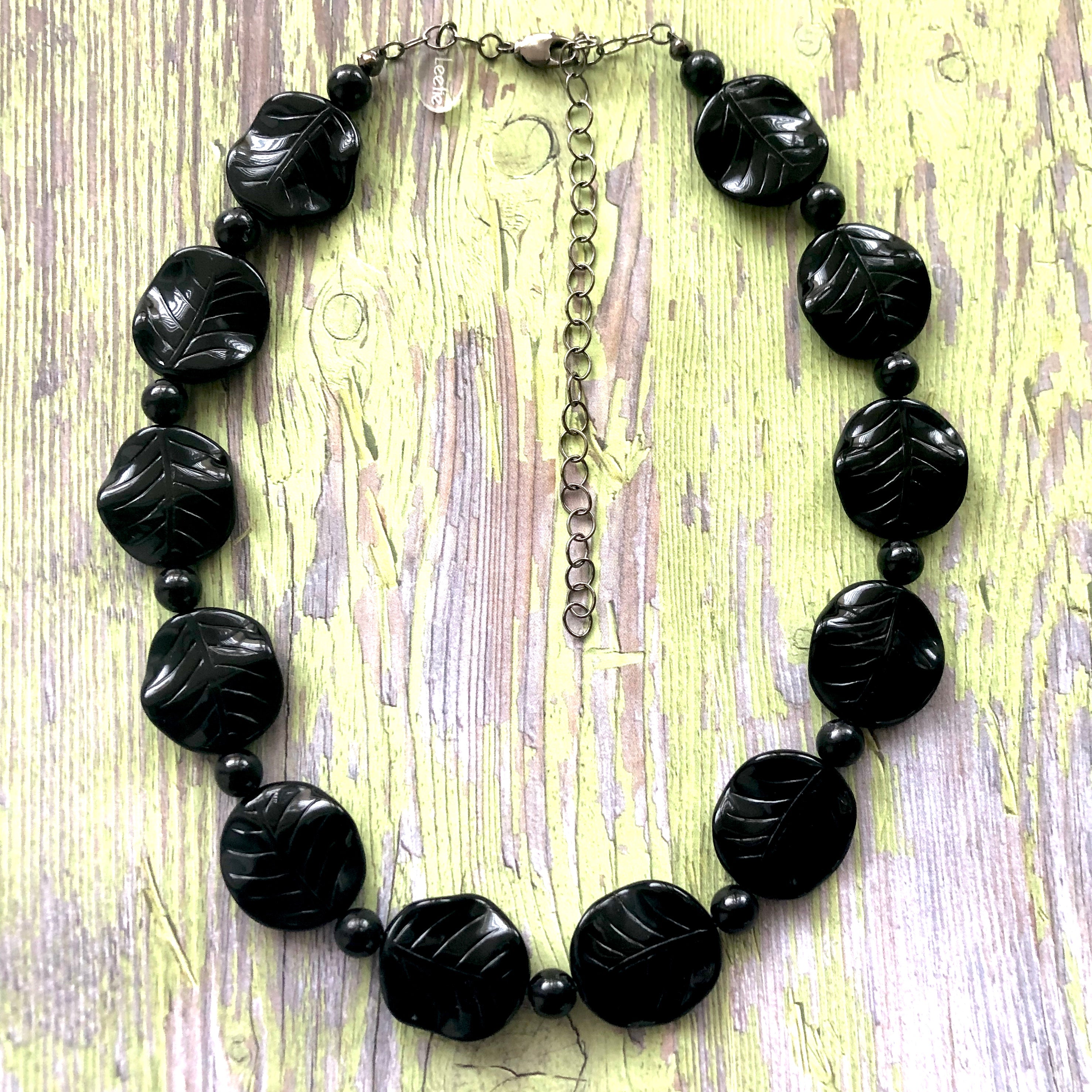 carved black plastic necklace