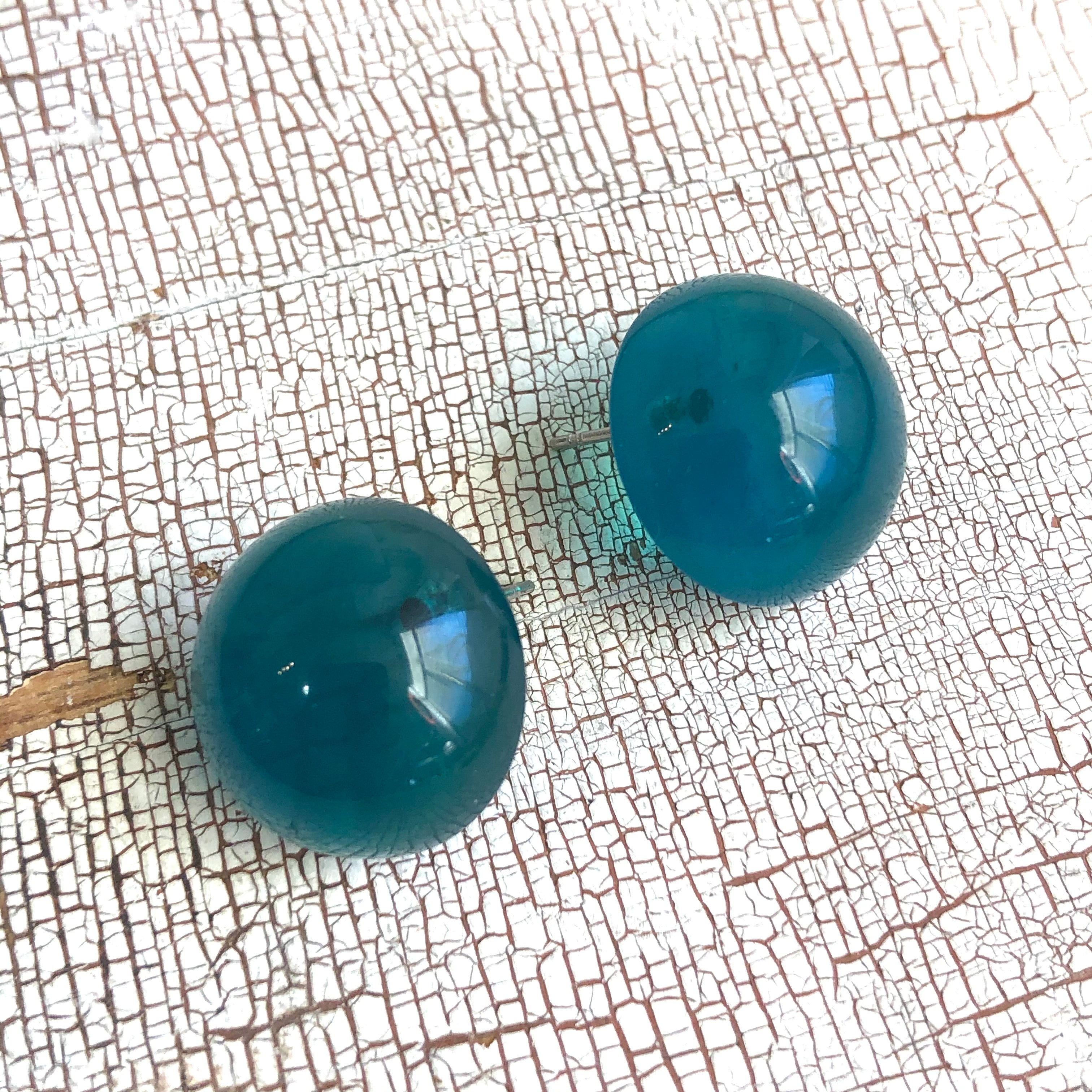 teal glow studs