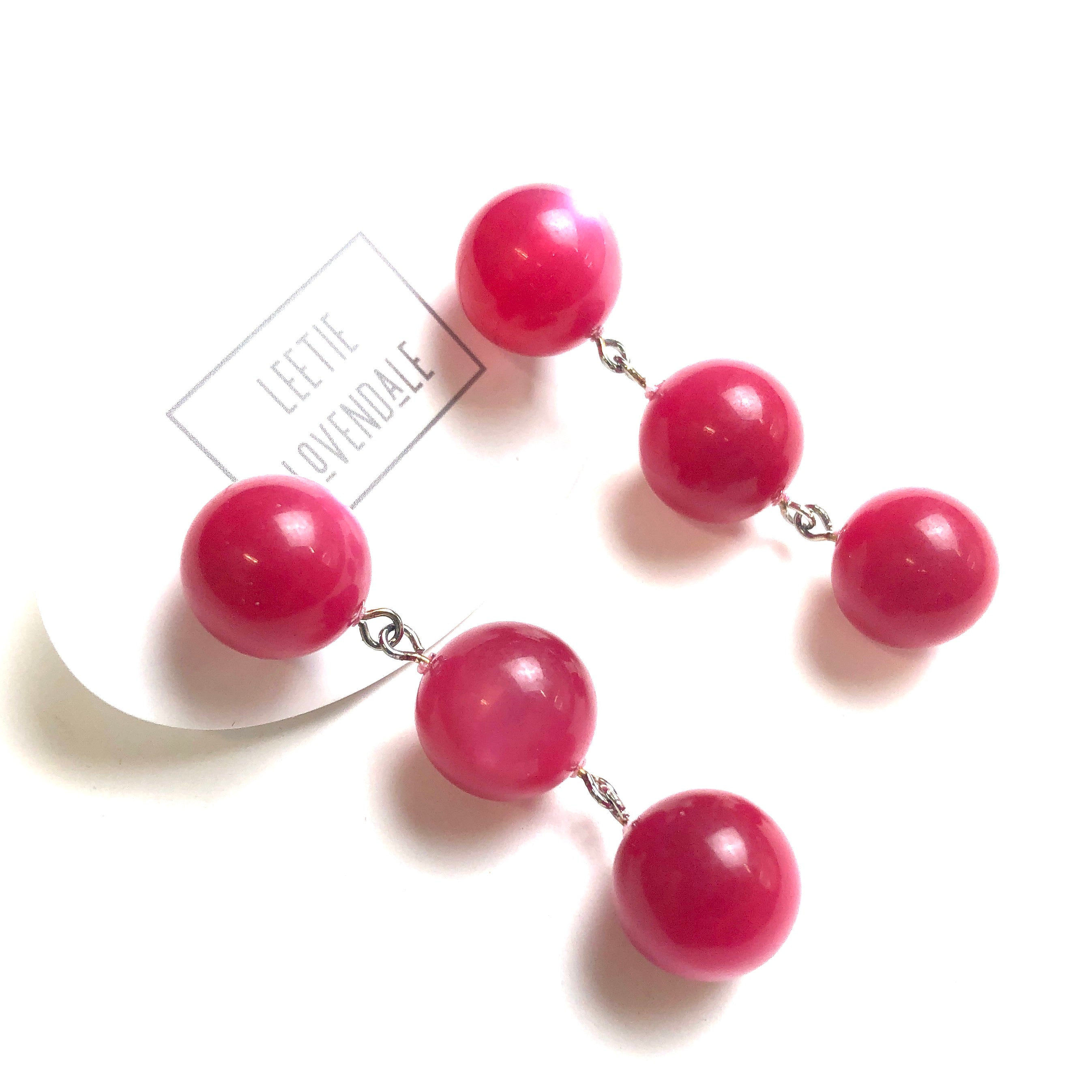 pink statement earrings