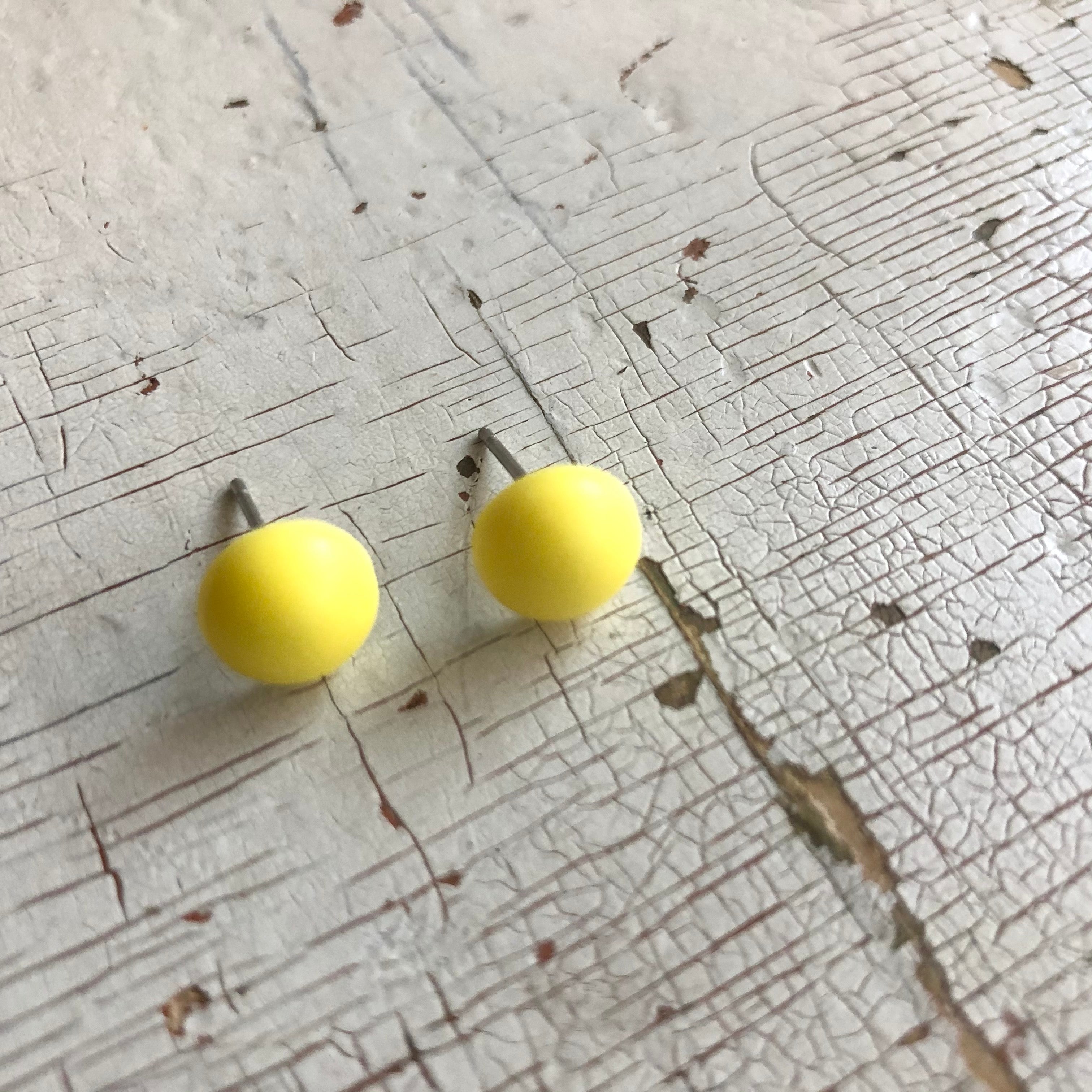 yellow button studs