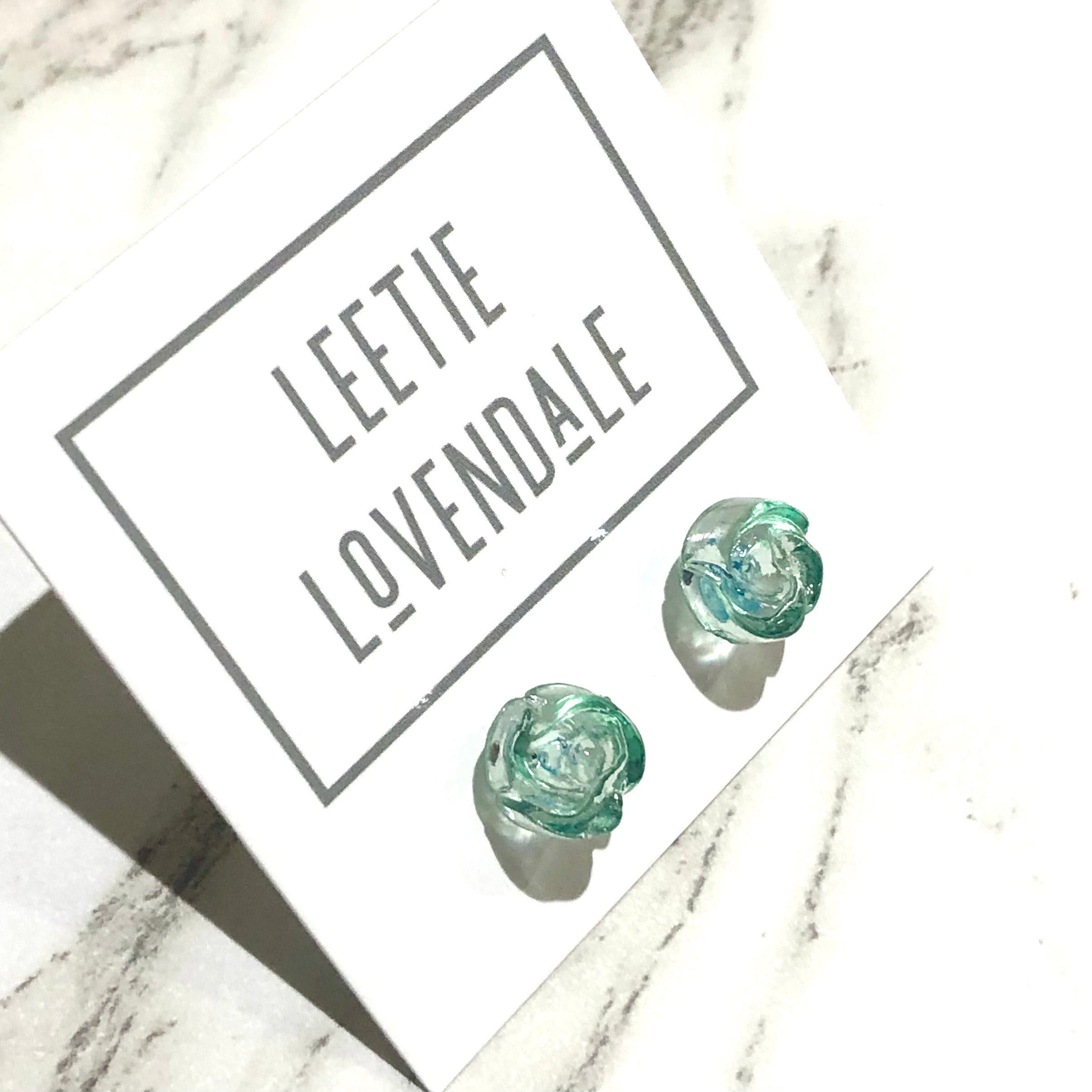 green stud earrings