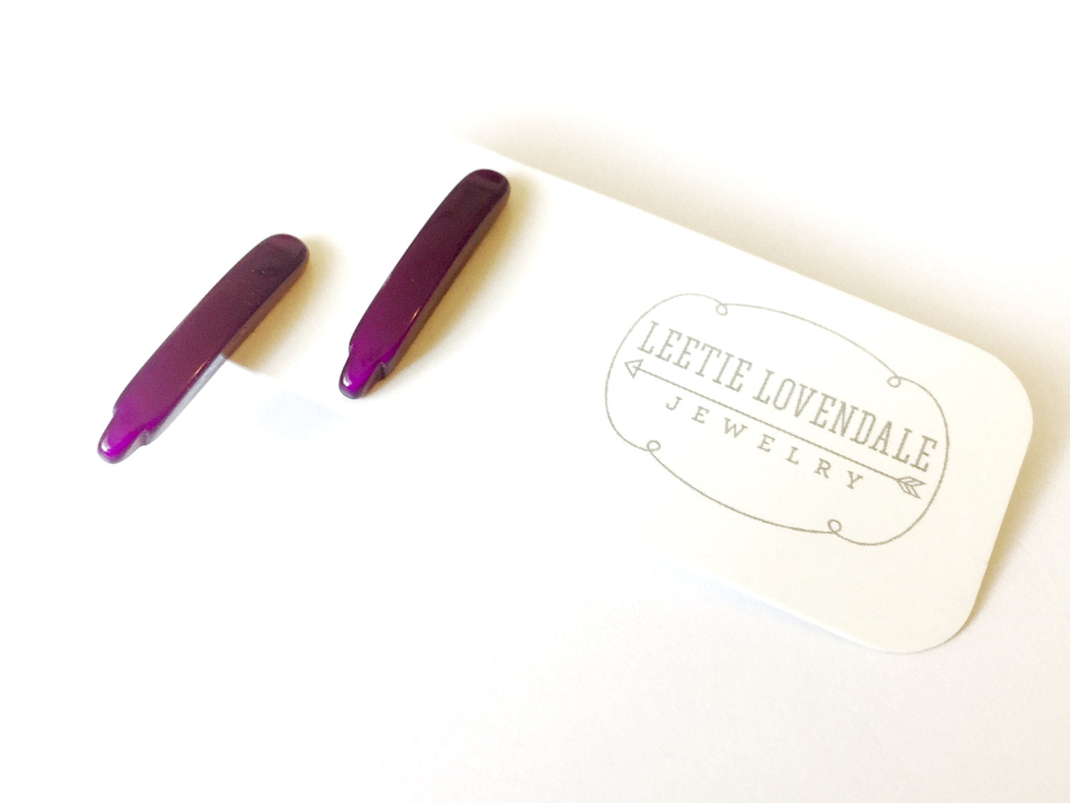 purple dagger earrings