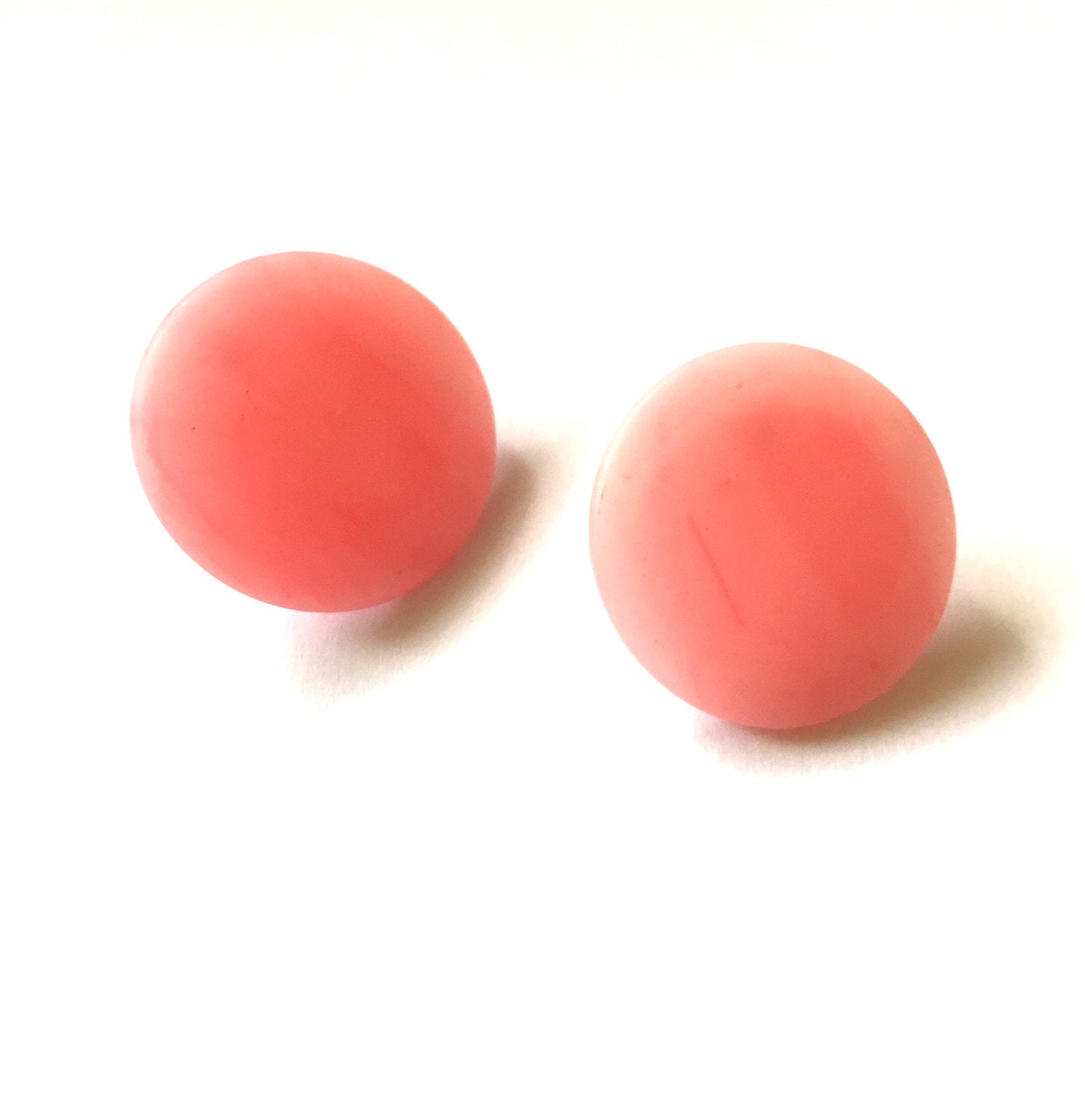 round pink lucite earrings