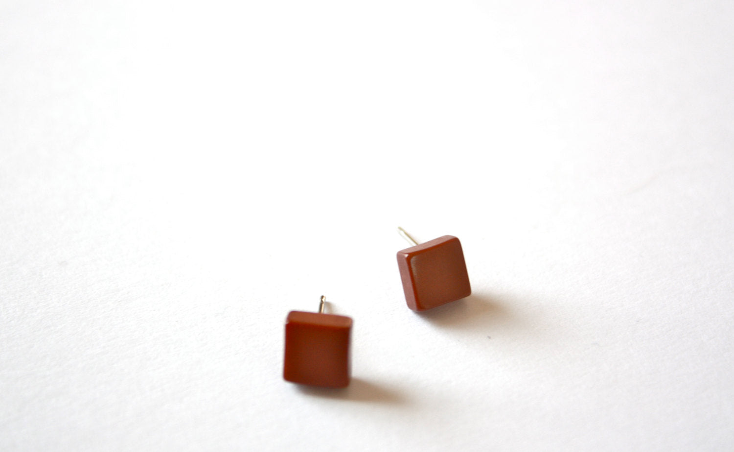 tiny brown studs