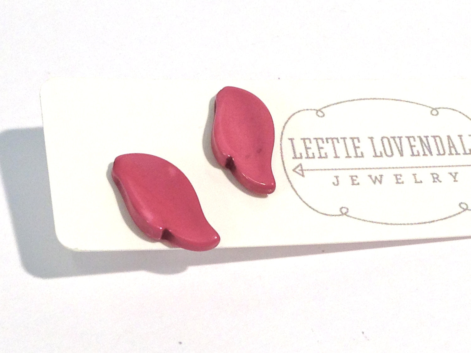 feather studs purple