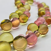 Necklace with multicolored beads on a white background