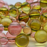 Close-up of multicolored lucite beads on a white background