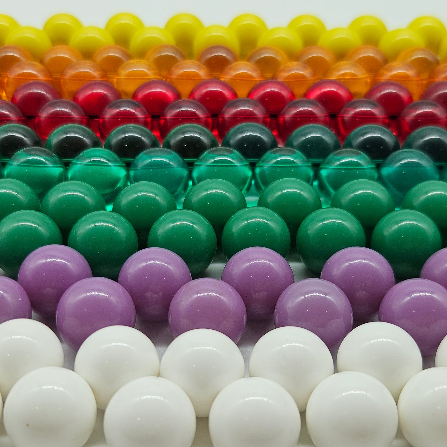 Colorful beaded necklaces in rows.
