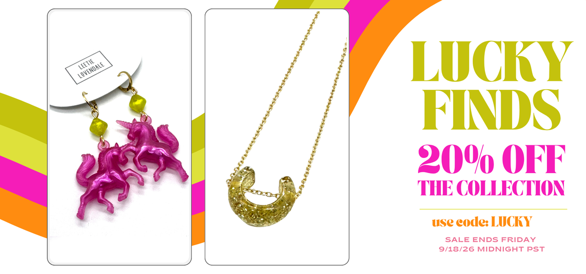 promotional image 20% off Lucky  Finds collection with photo of pink unicorn earrings and gold horseshoe necklace