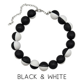 Black and white beaded necklace on a white background