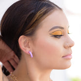 small hoop earrings retro makeup on woman