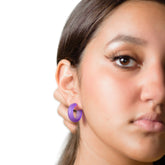small simple hoop earrings on model