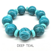 Turquoise beaded bracelet on a white background with &