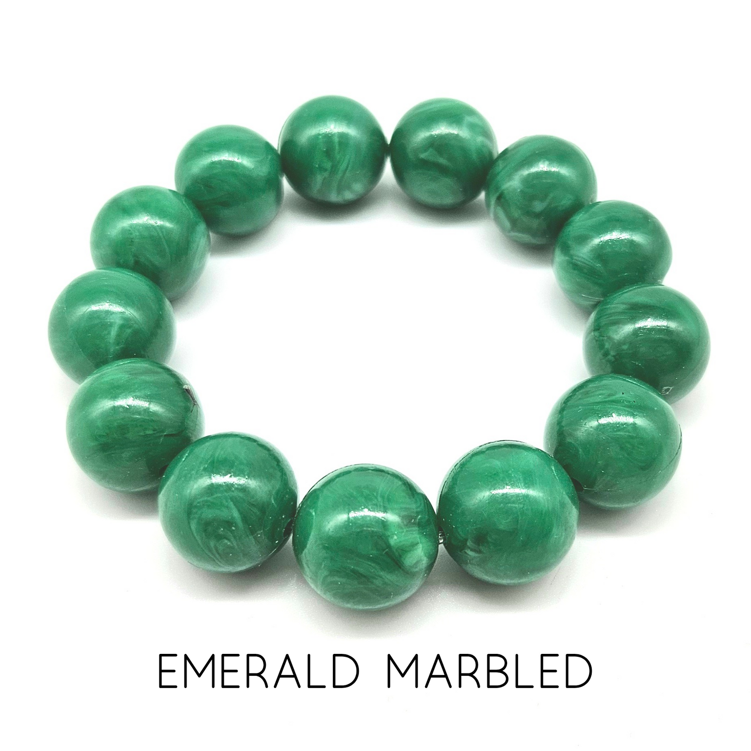 Green marbled bracelet on a white background with &